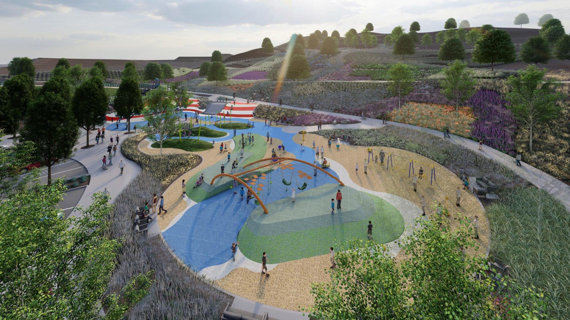 Aerial rendering of a large community park with playgrounds, sandy play areas, and winding paths.
