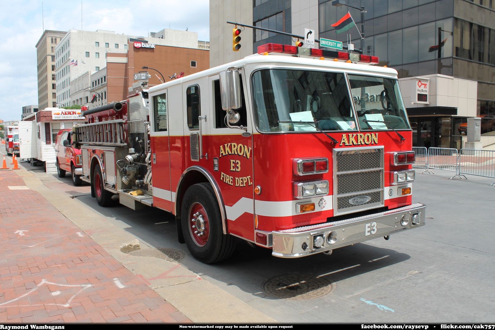 Red fire engine parked on a city street.