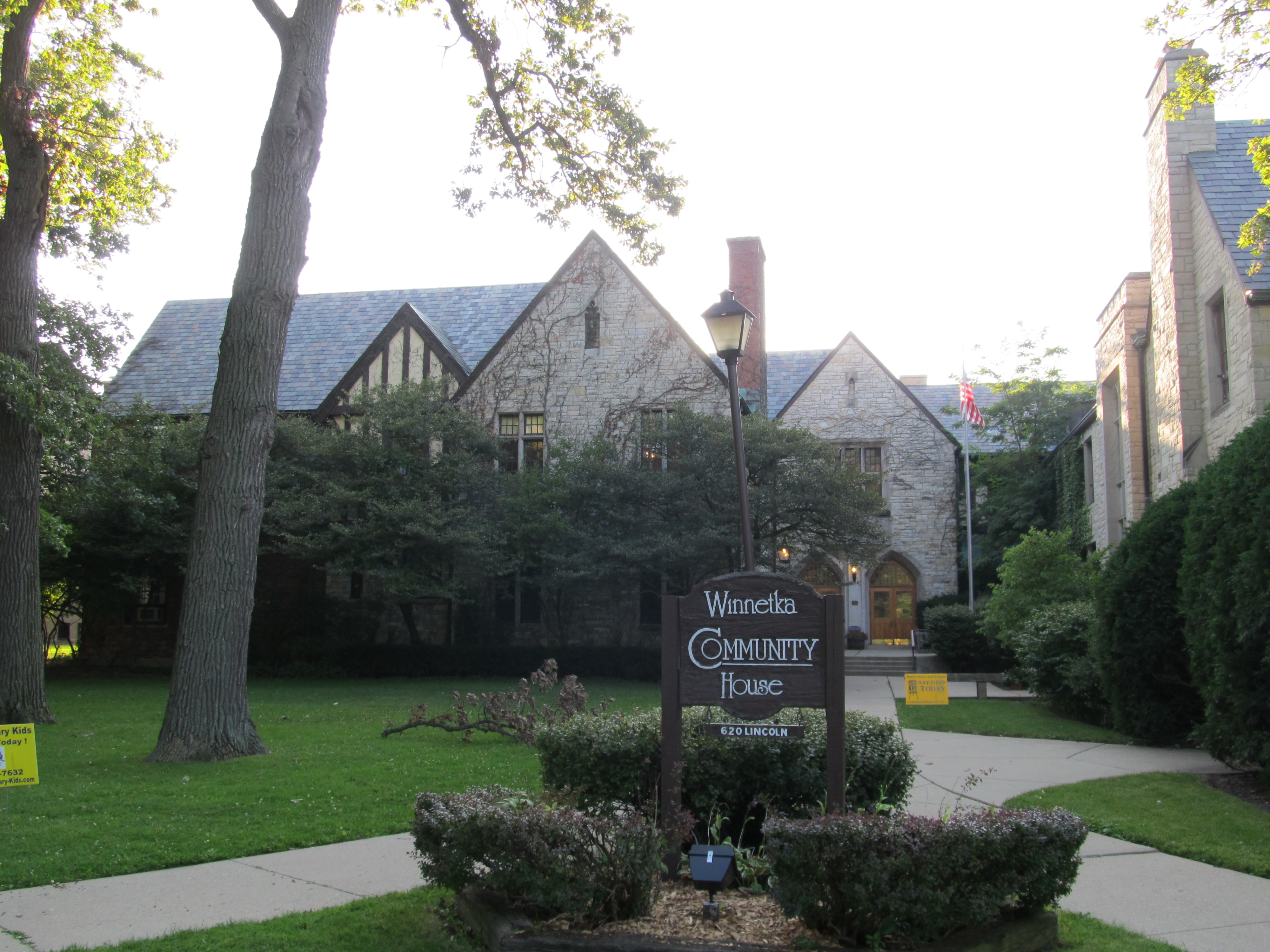 Stone Tudor-style building with a Winnetka Community House sign near the entrance.