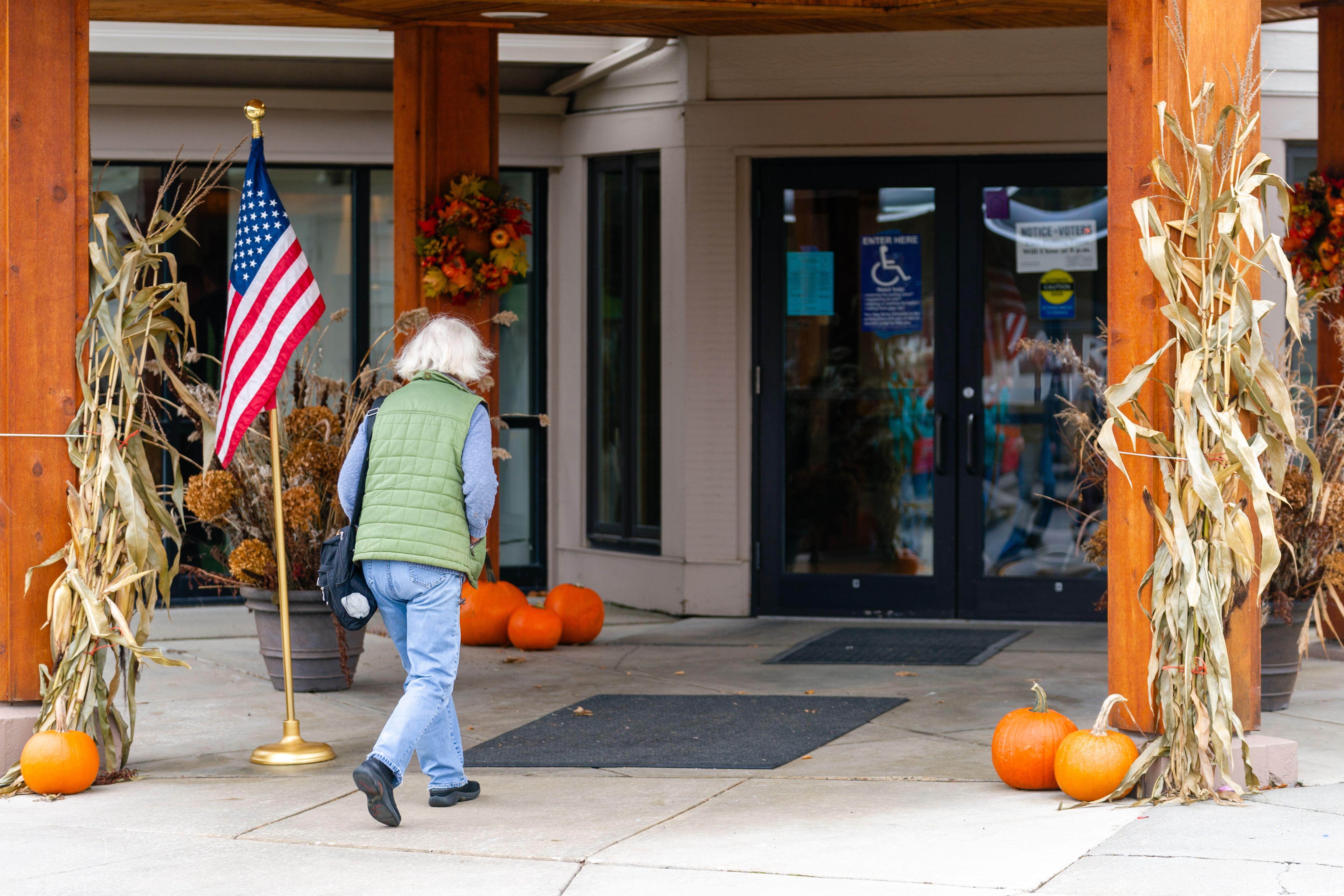 A person walks toward the entrance of a building used as a polling place.