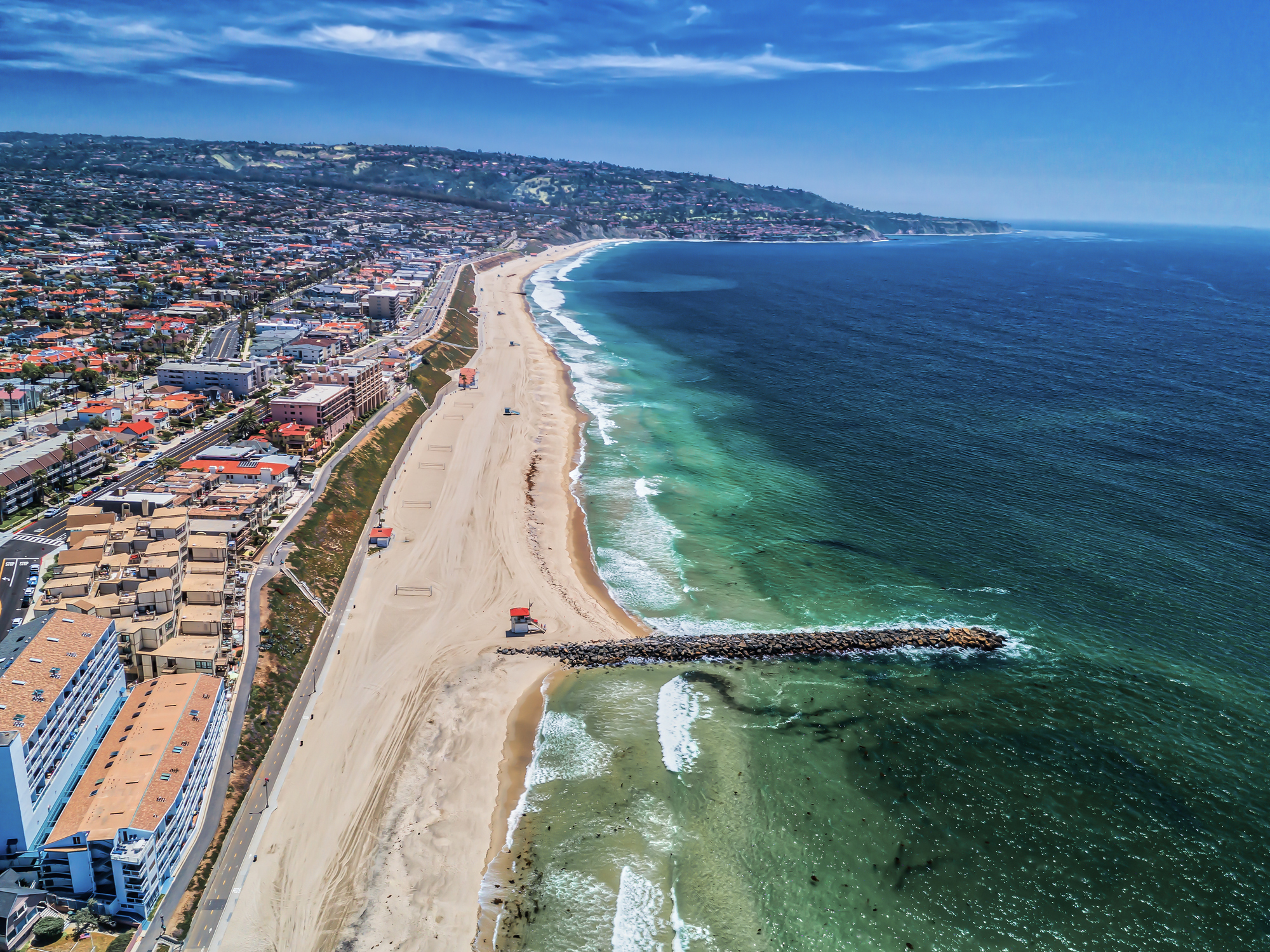 Redondo Beach, California. Aerial view of Jetty and Coastline with Palos Verdes in the distance.
