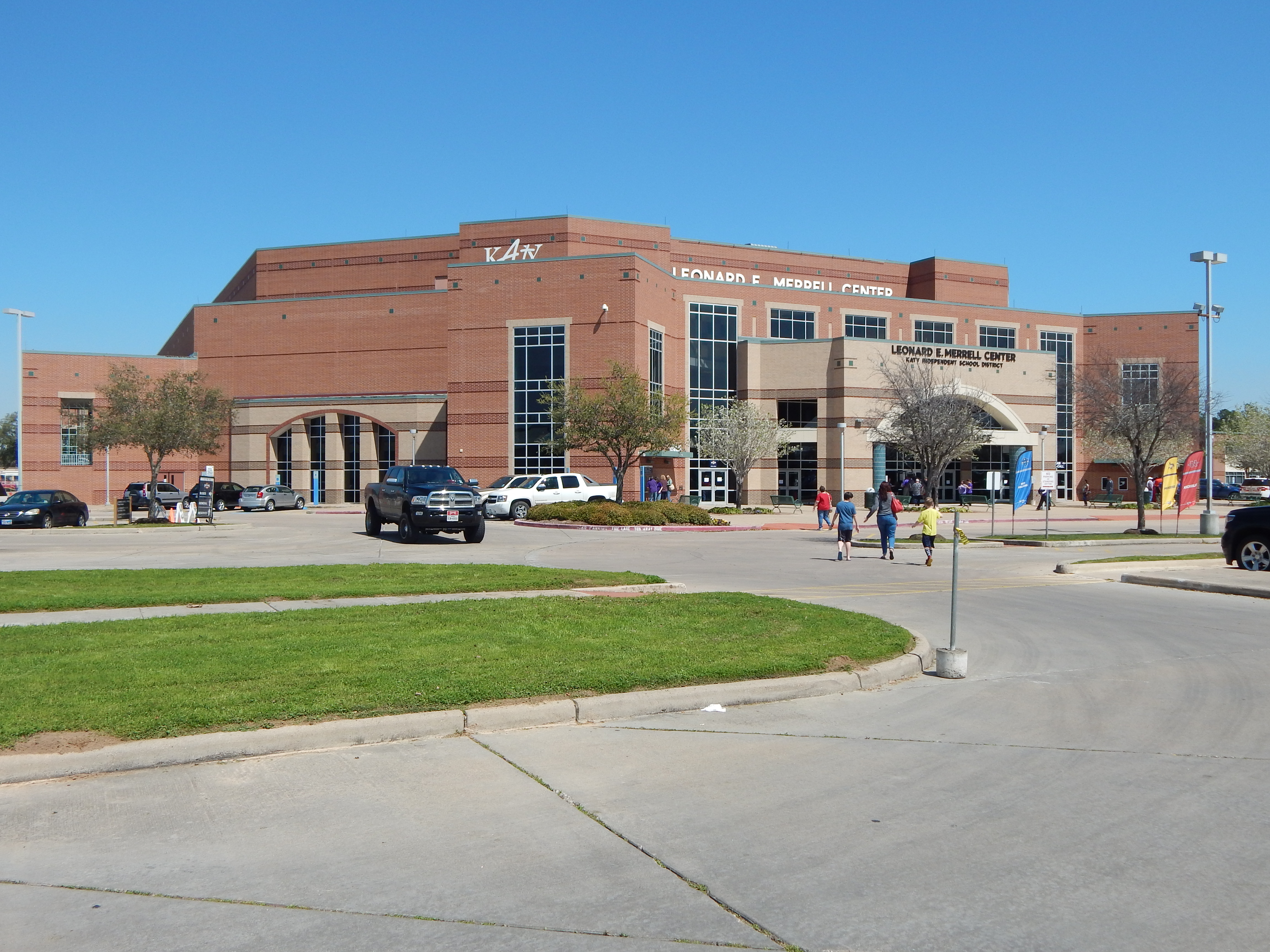 Exterior brick entrance of the Leonard E. Merrell Center on a sunny day.