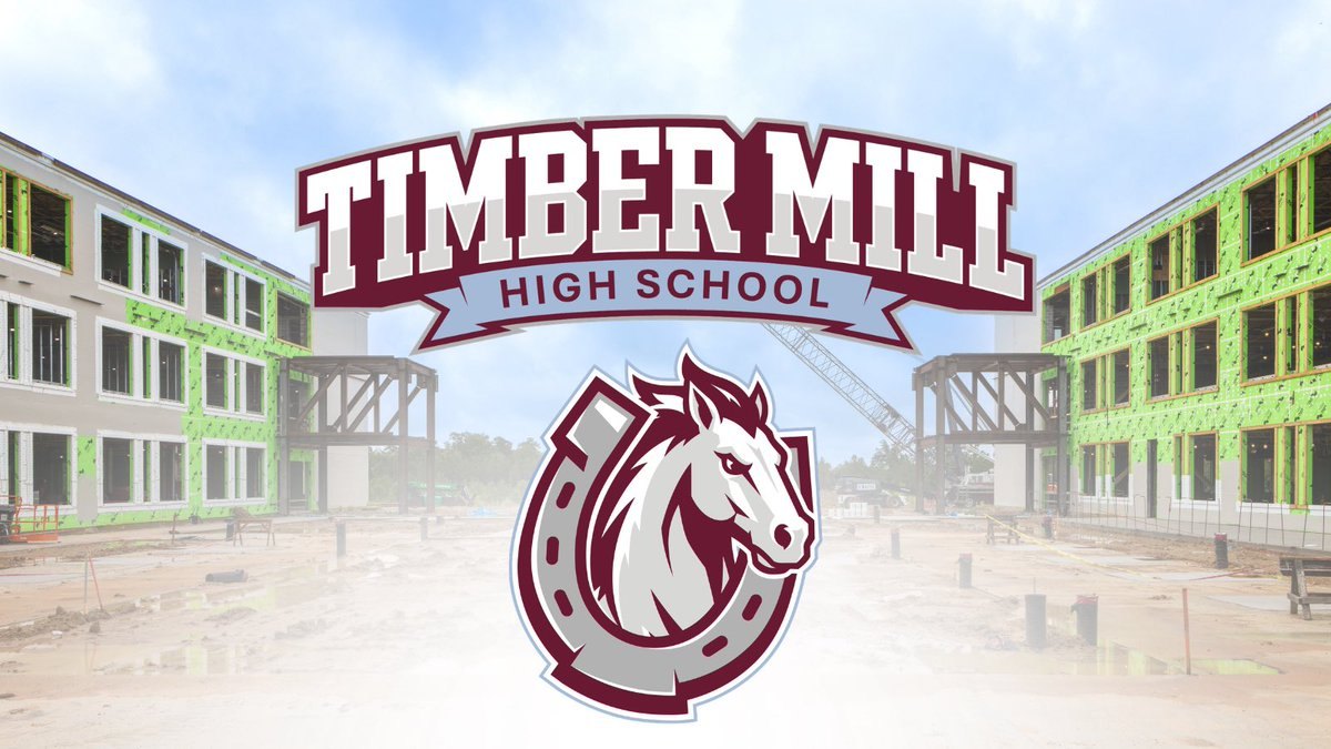 Maroon and white school logo with a horse head inside a horseshoe over a building under construction.