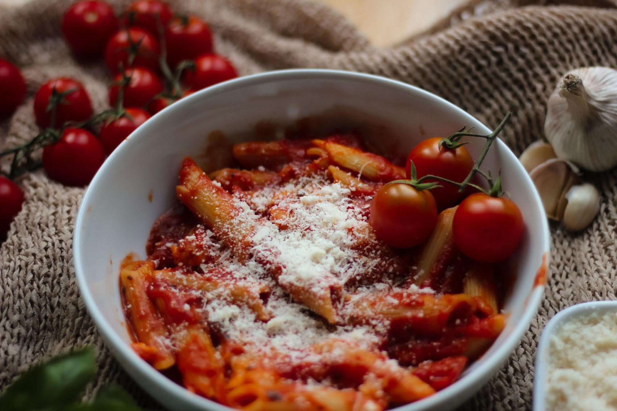 Tasty penne pasta in a rich tomato sauce, topped with parmesan cheese.
