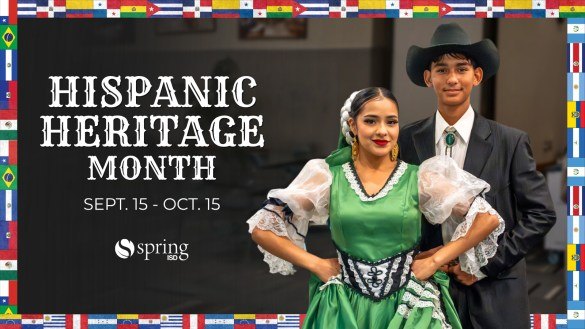 Two young people in traditional Hispanic folk dance attire posed in front of Latin American country flags.