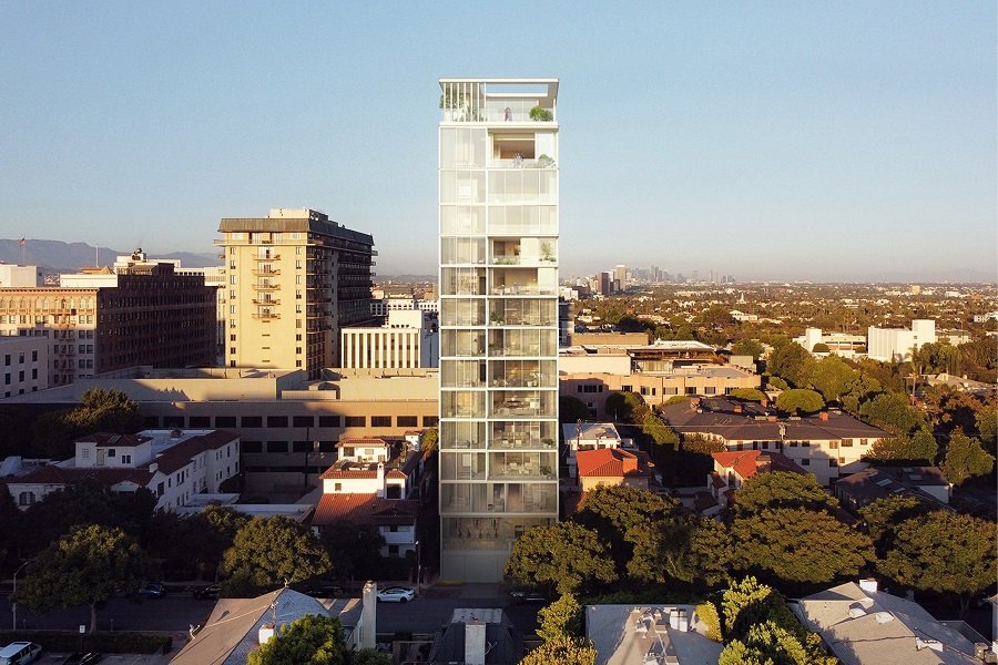 Rendering of a tall glass residential tower rising above a low-rise urban neighborhood.