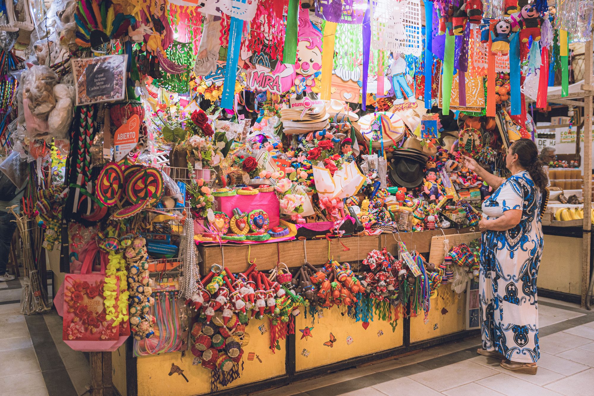 Vibrant handicrafts display at a bustling market stall in Guanajuato, Mexico.