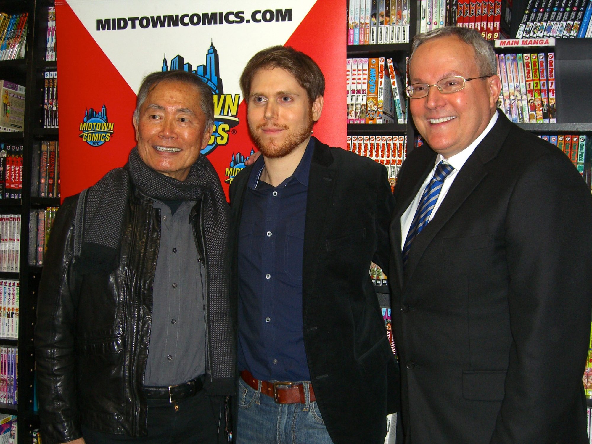 Star Trek actor George Takei and his husband, Brad Altman (right), posing with a fan (center) at Midtown Comics Times Square in Manhattan, at a December 5, 2012 signing for Archie's Pal Kevin Keller #6. That series stars Kevin Keller, the first openly gay character to appear in Archie Comics, and issue #6 guest stars Takei, an LGBT rights activist.

This photo was created by Luigi Novi. It is not in the public domain, and use of this file outside of the licensing terms is a copyright violation. If you would like to use this image outside of the Wikimedia projects, you may do so, only if I am properly credited, either by linking the photograph to this page, or with an easily visible credit placed near the photo in each instance in which it is used. Please credit authorship as follows:  © Luigi Novi / Wikimedia Commons.  Please maintain the original file name in all uses.
You can see a gallery of some of my other photos 
here. If you have any questions, you can contact me by sending me an email or leaving a note at the bottom of my Wikipedia talk page.