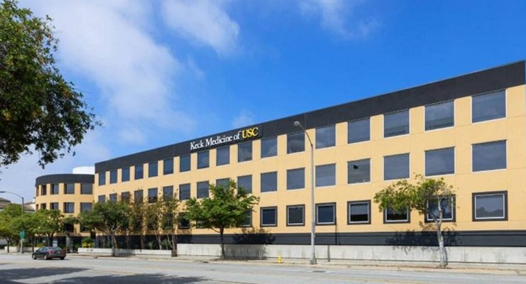 A multi-story commercial building with Keck Medicine of USC signage on its facade.
