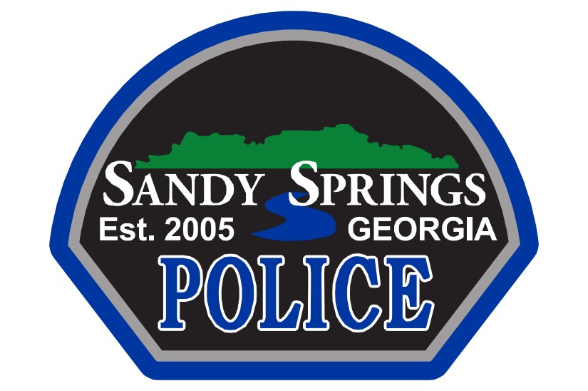 Blue and black shield-shaped shoulder patch reading Sandy Springs Police, Georgia.