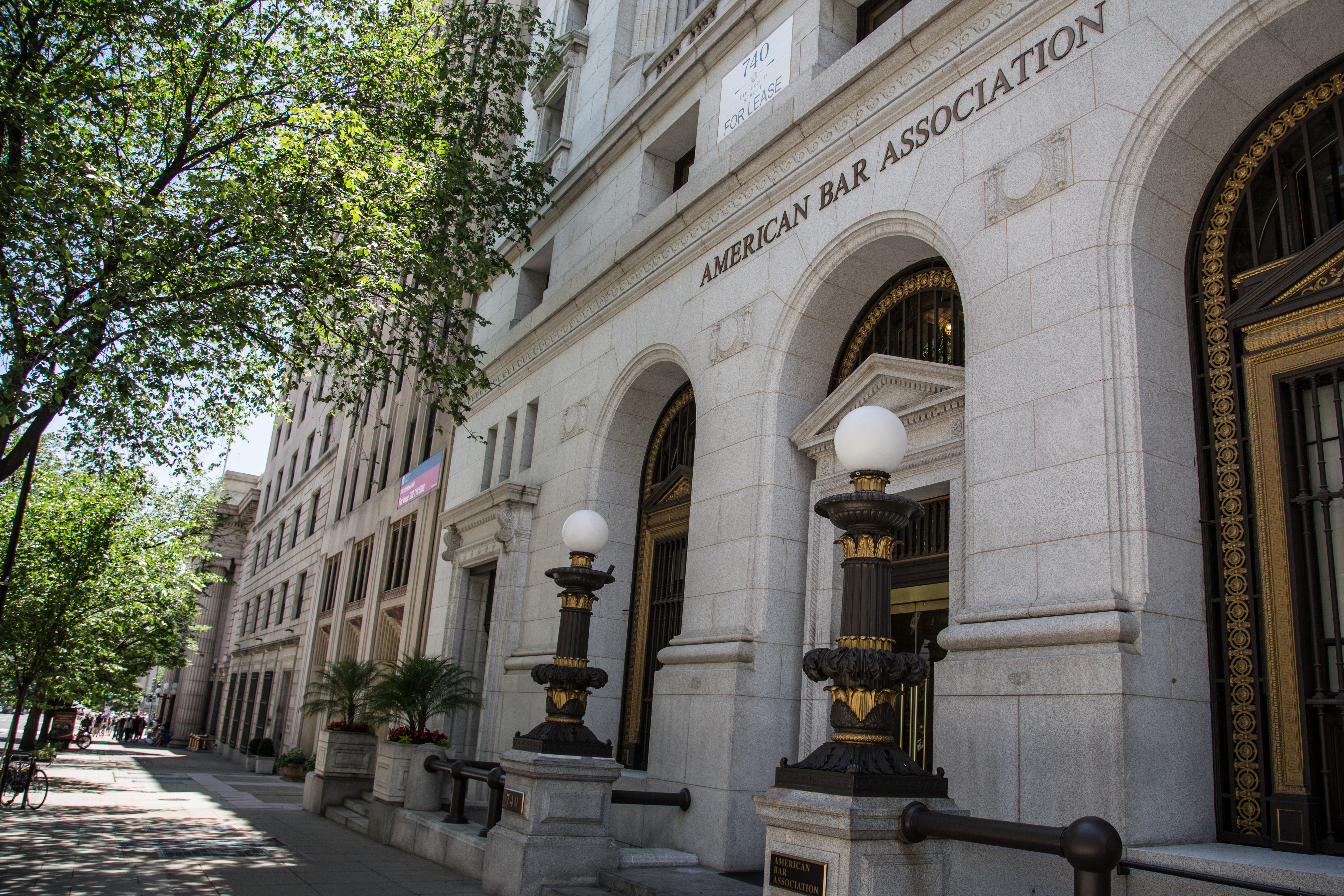 Classical stone building with 'American Bar Association' engraved above ornate arched entrances.