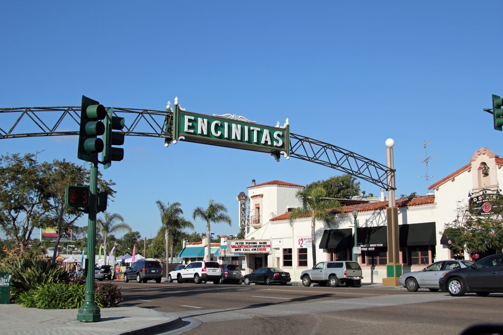 Downtown Encinitas, California, USA.  Pictured is the Welcome Arch and the La Paloma Theater.