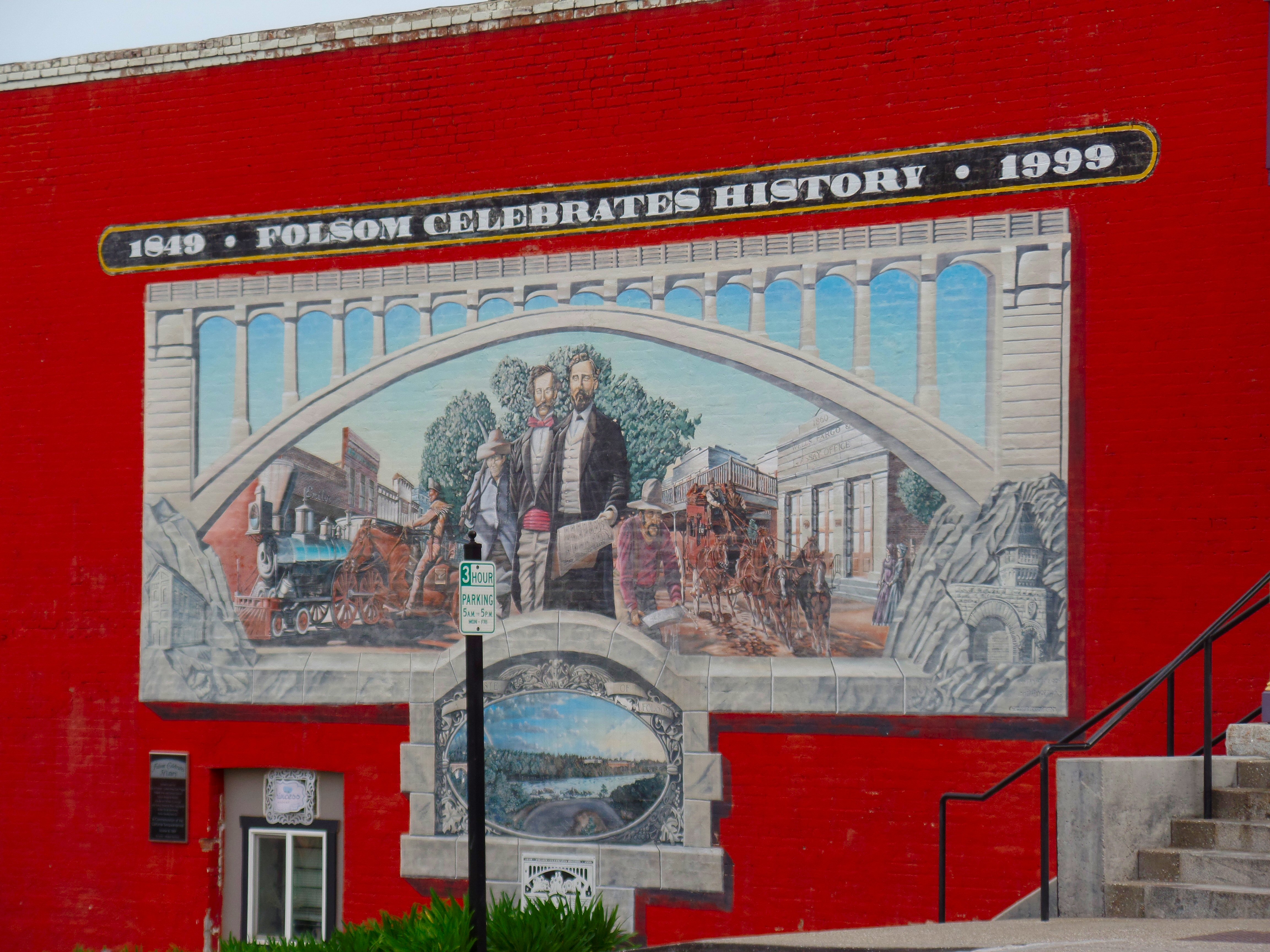 A painted mural on a red brick building along Sutter Street in Folsom.
