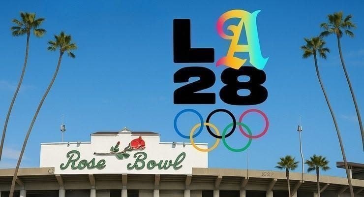 Rose Bowl stadium facade with LA28 Olympic logo, Olympic rings, and palm trees.