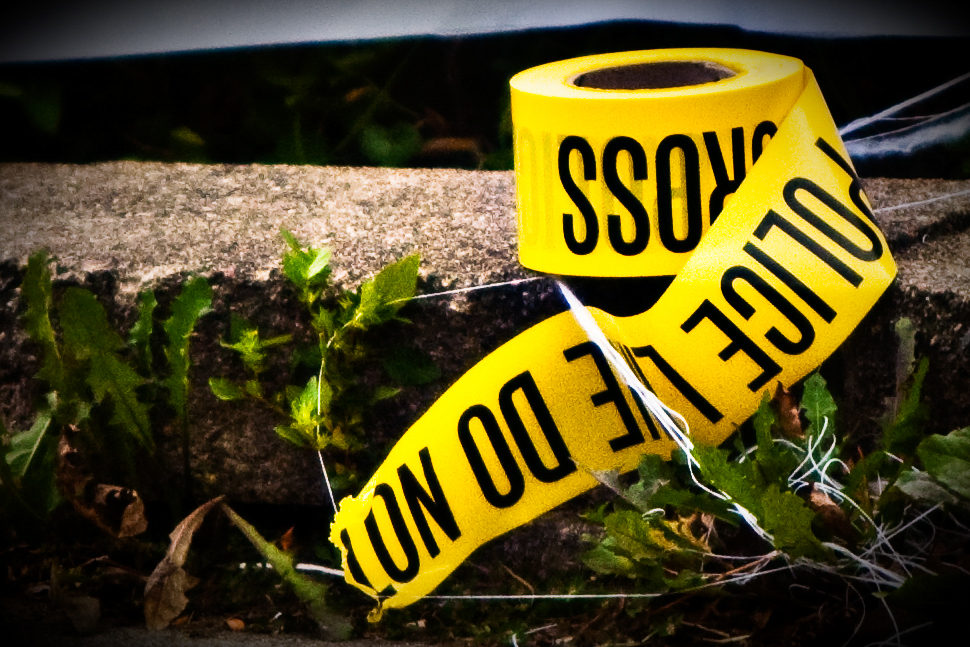 A roll of police tape (police line) lies on the ground outside a home being foreclosed on in Minneapolis, Minnesota in 2009.