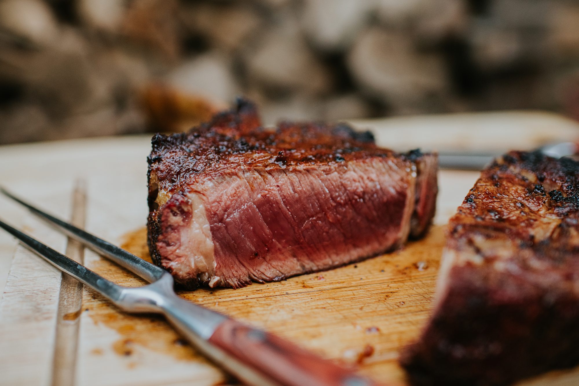 Close-Up of Medium-Rare Steak on Wooden Cutting Board