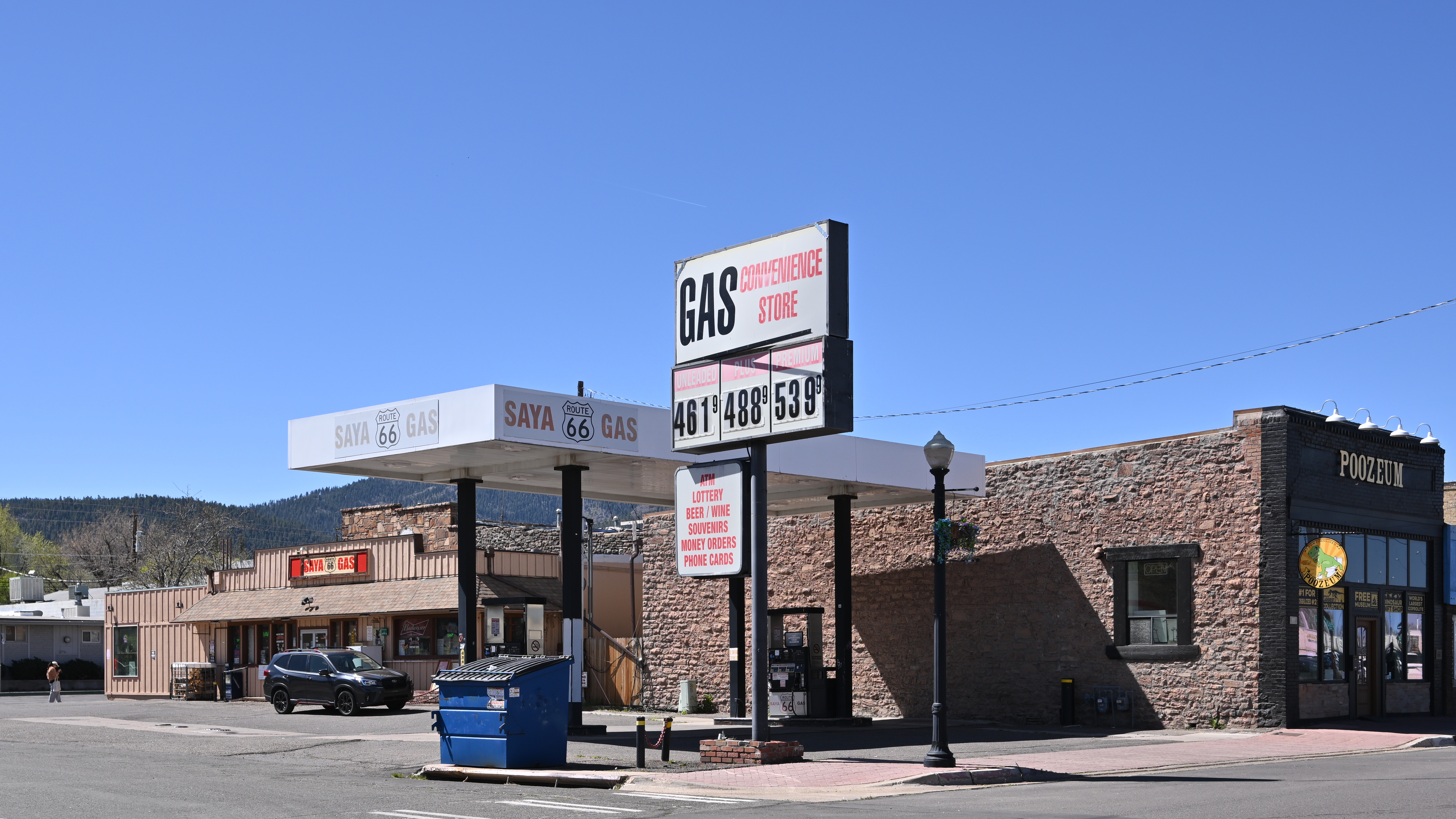 Gas station price sign showing fuel costs above four dollars per gallon.