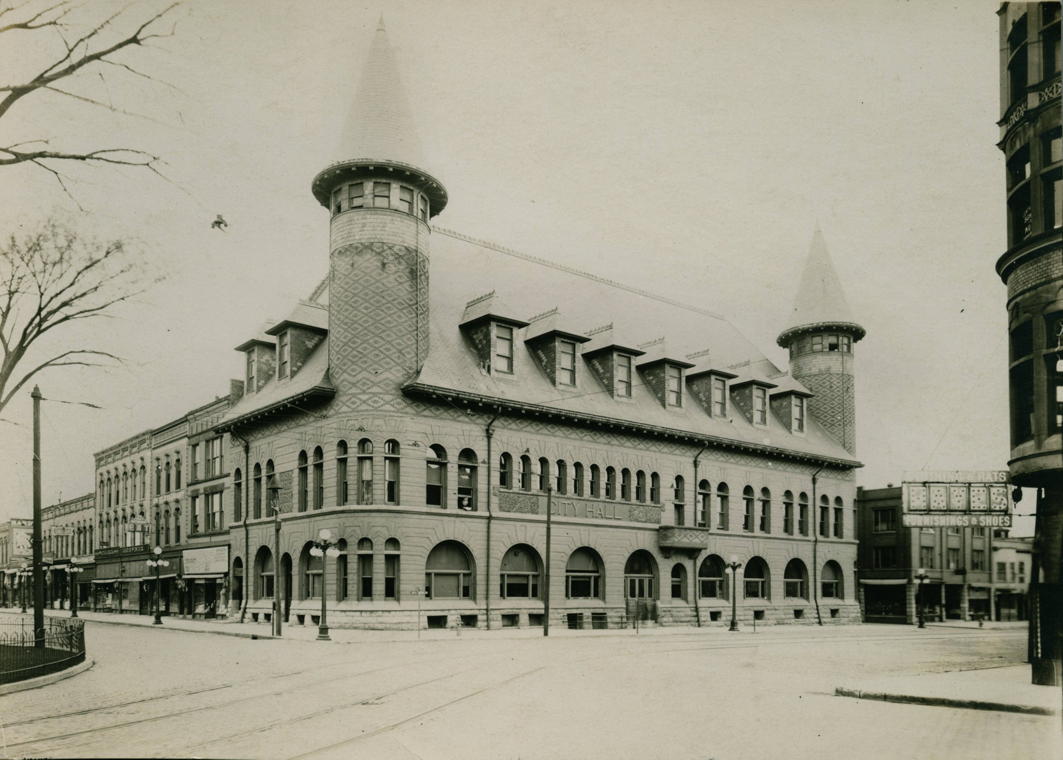 Historic Evanston Town Hall, a Victorian-era building with turrets and arched windows.