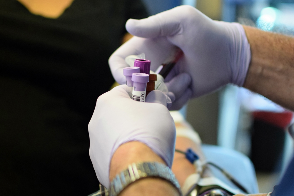A technician secures several test tubes filled with blood during a drive in New Orleans.