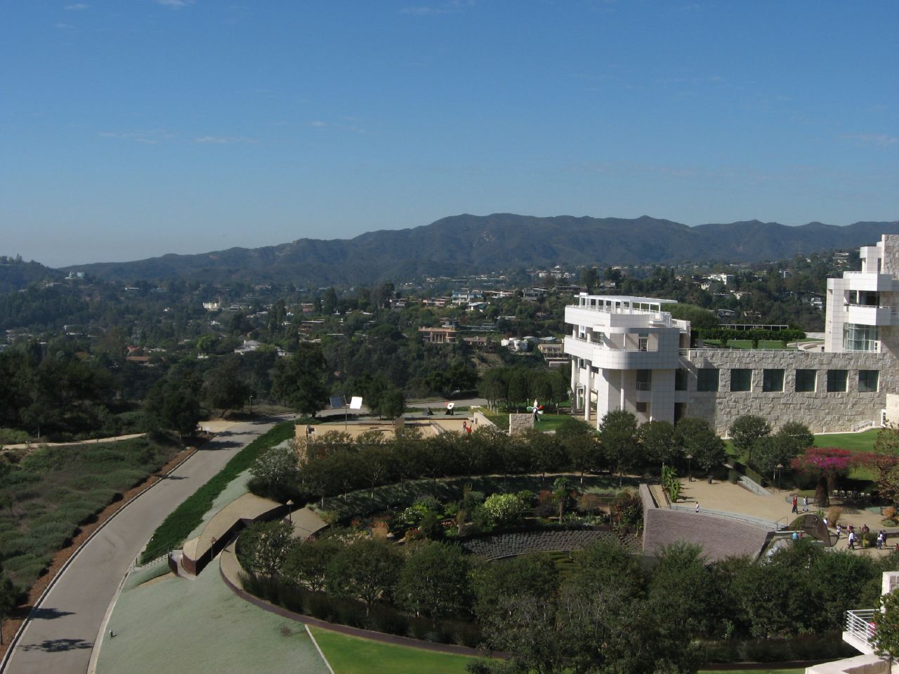 Aerial view of the Getty Center's white modernist campus atop a Brentwood hillside.