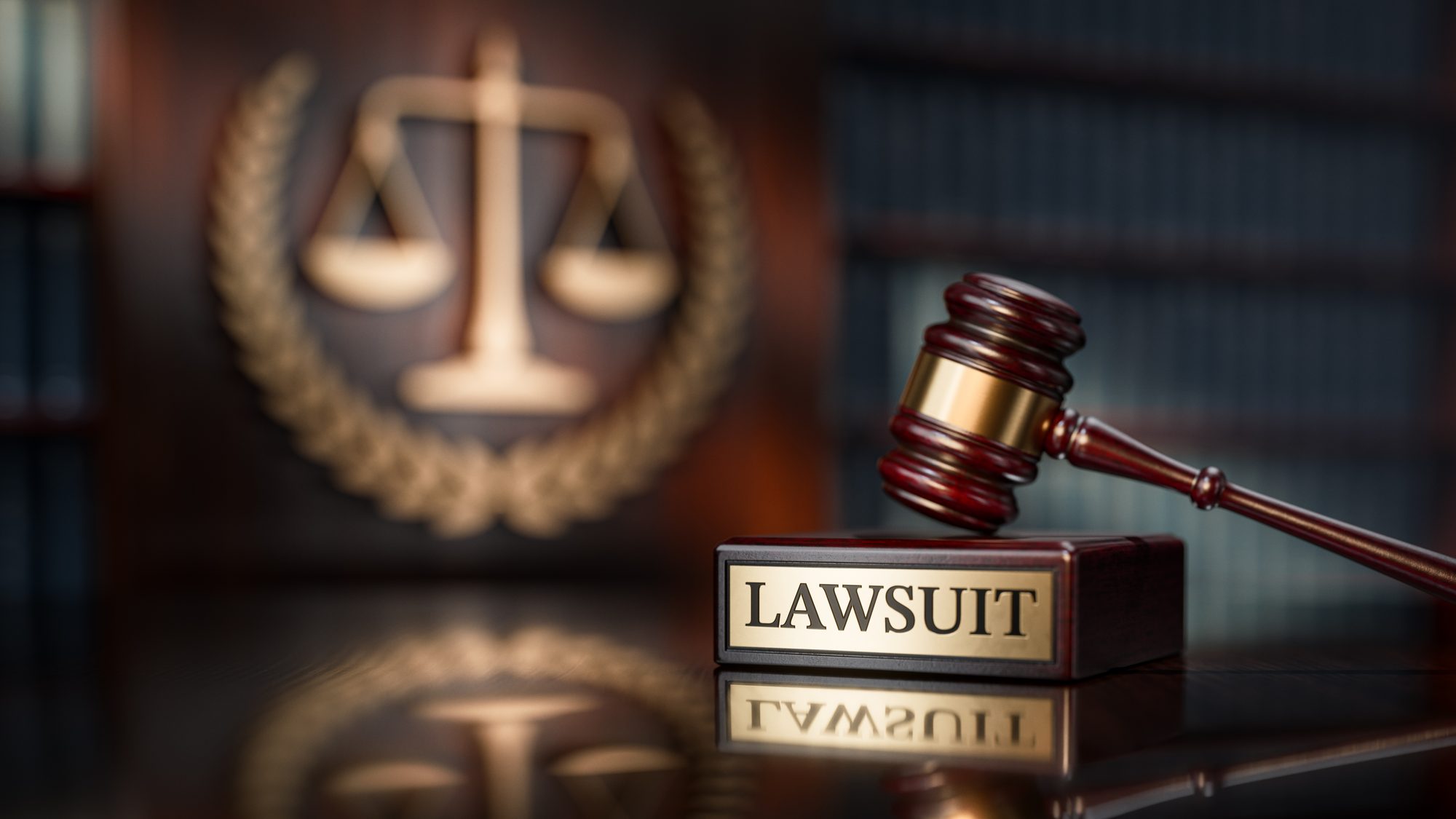 Lawsuit: Judge's Gavel as a symbol of legal system and wooden stand with text word
