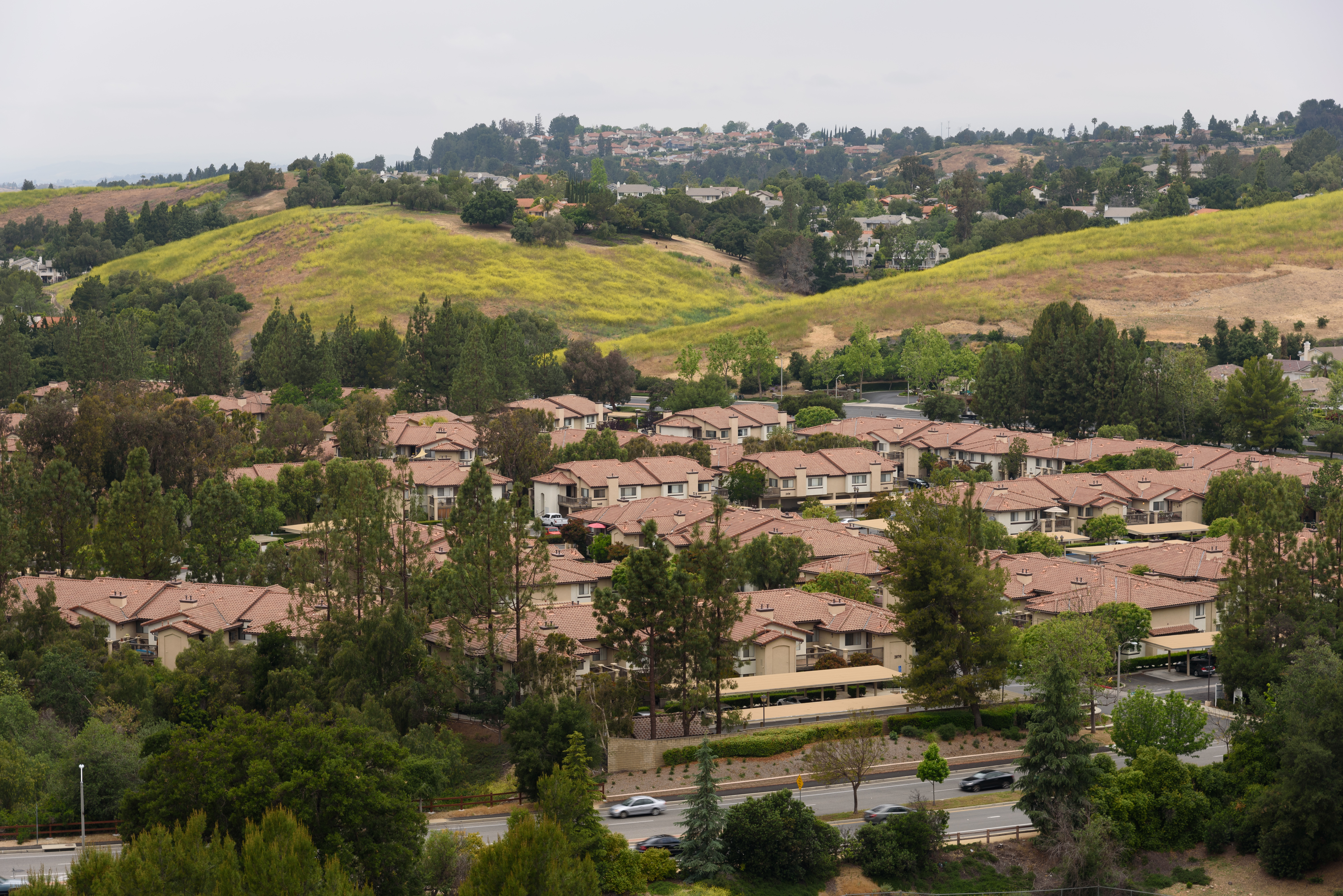 Rows of suburban homes with terracotta roofs on a hillside in Thousand Oaks.