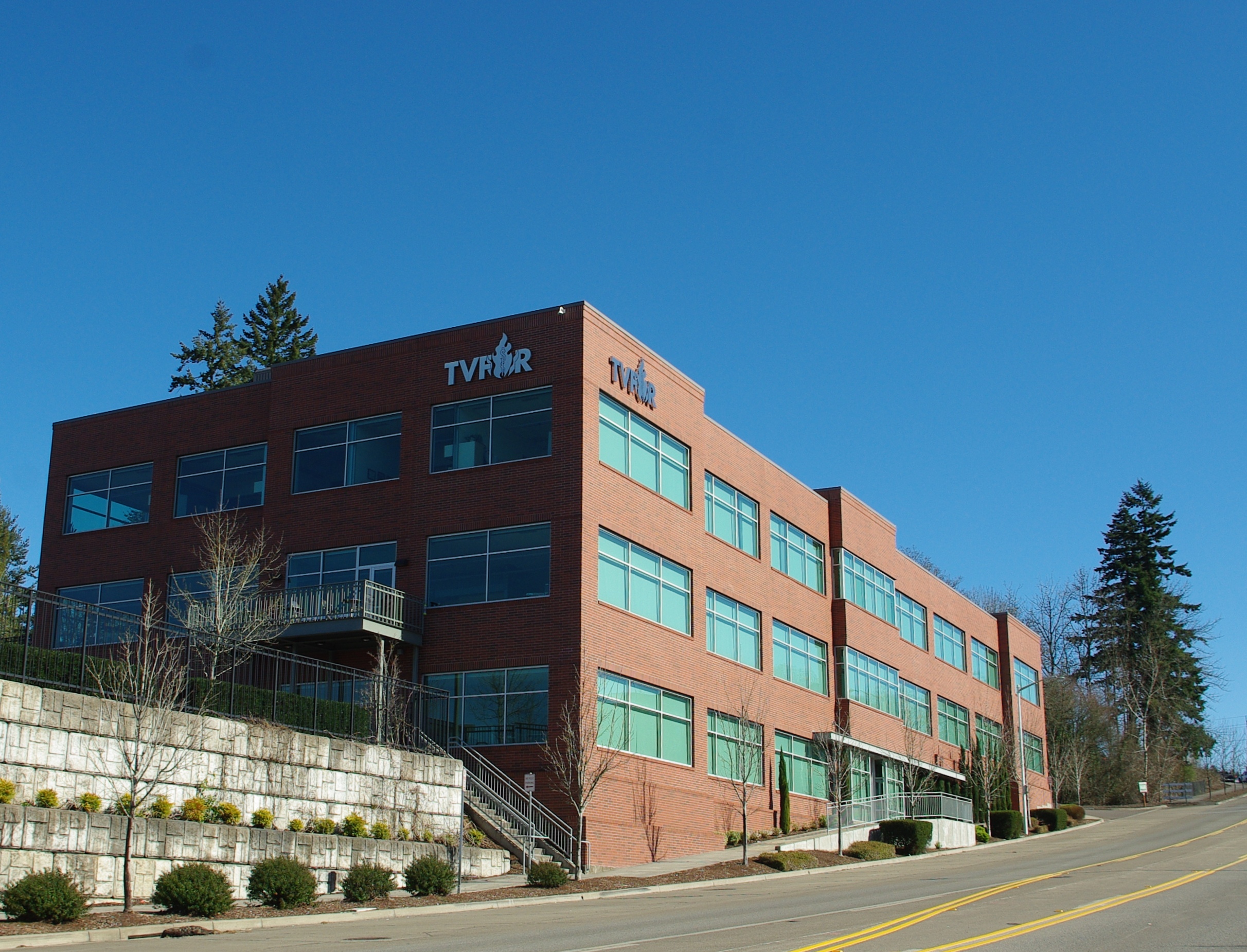 Three-story red brick building with Tualatin Valley Fire and Rescue signage on the exterior.