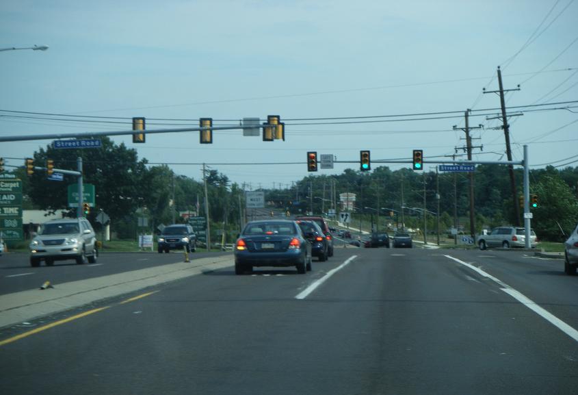 Multi-lane road with Route 611 highway signs in a suburban Pennsylvania setting.