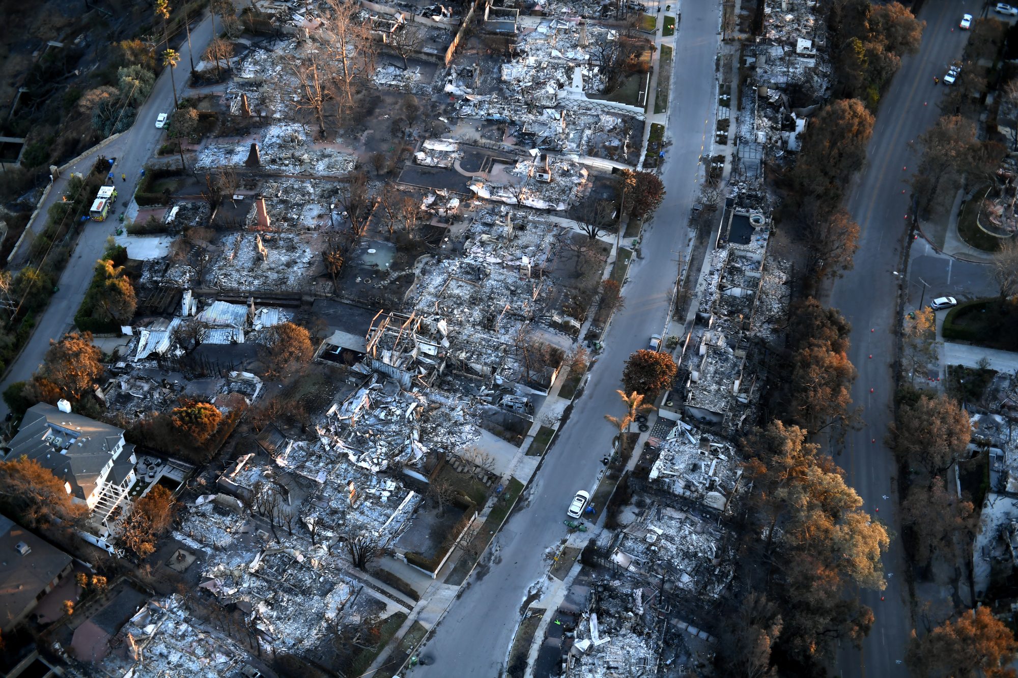 Evening light falls across homes and neighborhoods devastated by the Palisades Fire in areas near Pacific Palisades, California, Jan. 14, 2025. More than 2,500 National Guard personnel have been called up as part of wildfire response efforts and have been providing aerial and ground firefighting support, security and traffic control, and logistical support in support of state, and federal authorities. (U.S. Army photo by Sgt. 1st Class Jon Soucy)