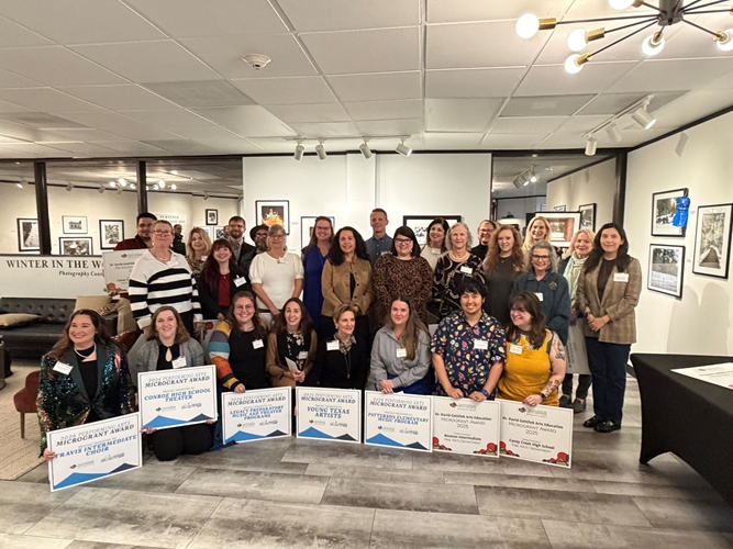 People gather for photo to celebrate microgrants. 