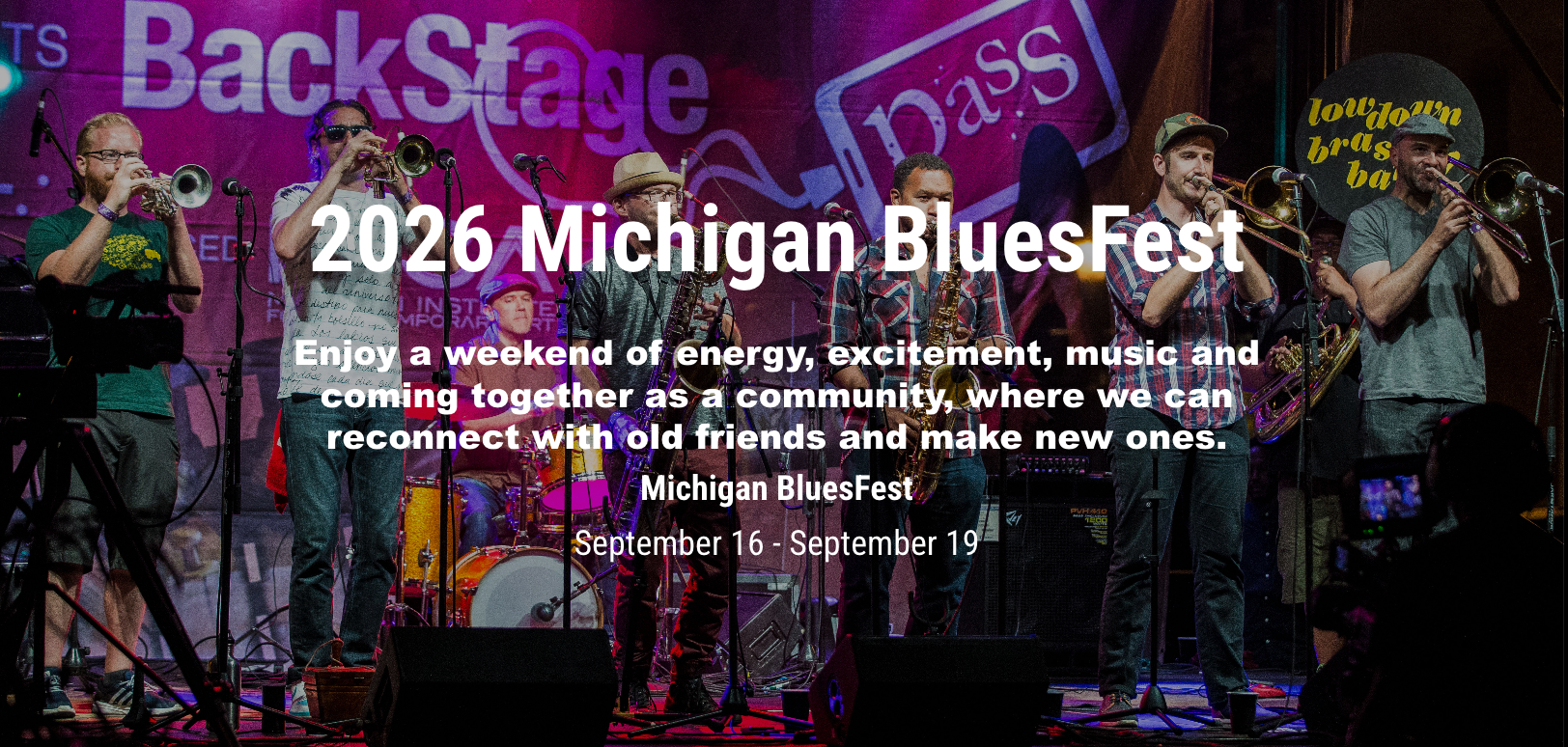 A promotional graphic for the 2026 Michigan BluesFest showing a brass band performing onstage at UrbanBeat in Old Town Lansing, with text reading "2026 Michigan BluesFest, September 16-September 19."