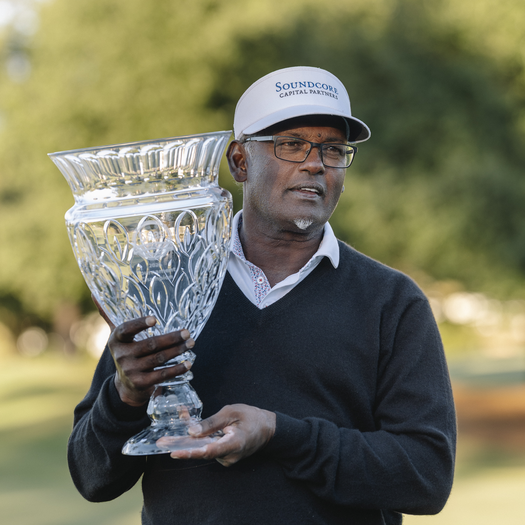 Vijay Singh holding the 2026 SAS Championship trophy.