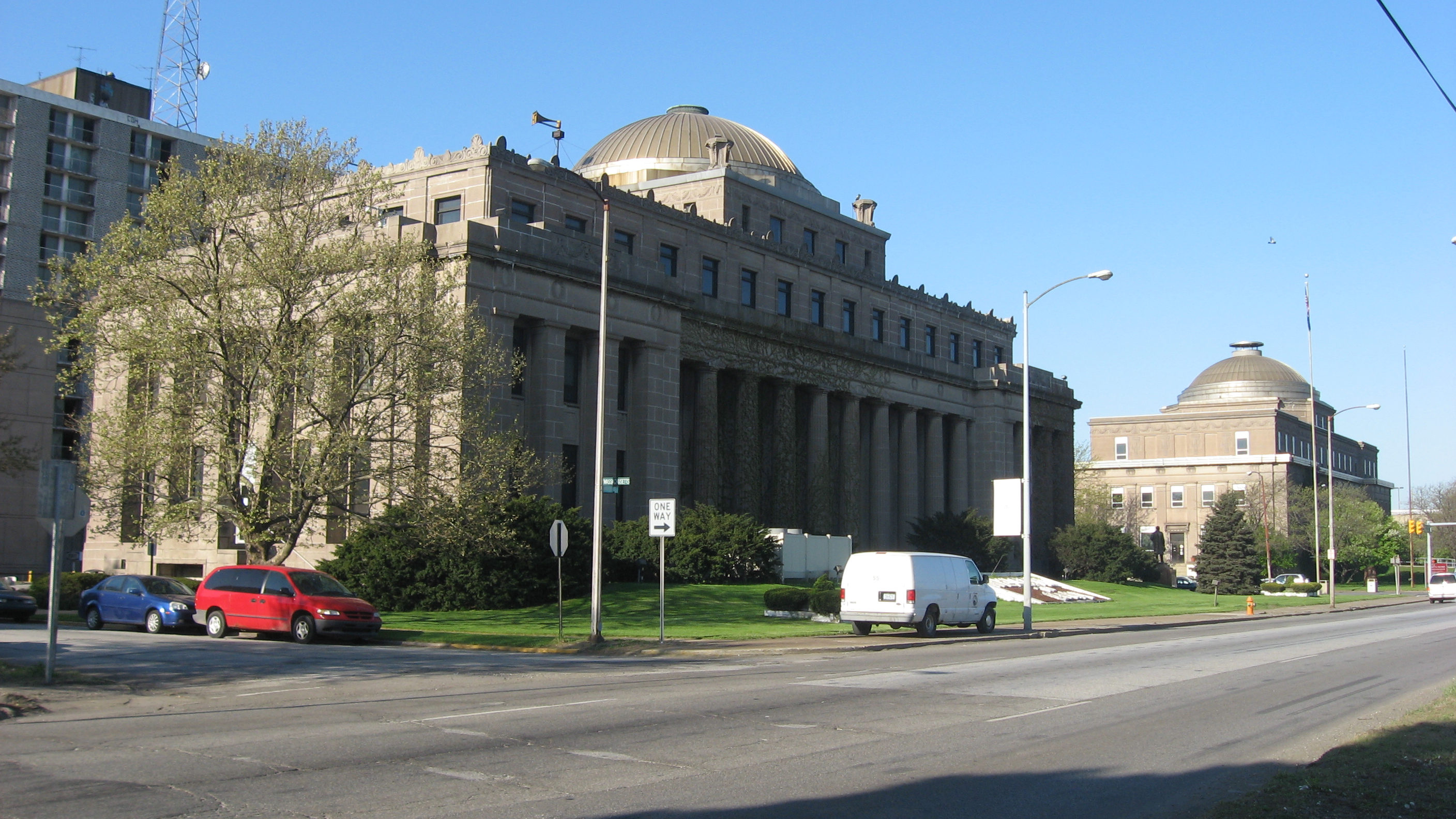 Neoclassical stone government buildings line a downtown street in Gary, Indiana.