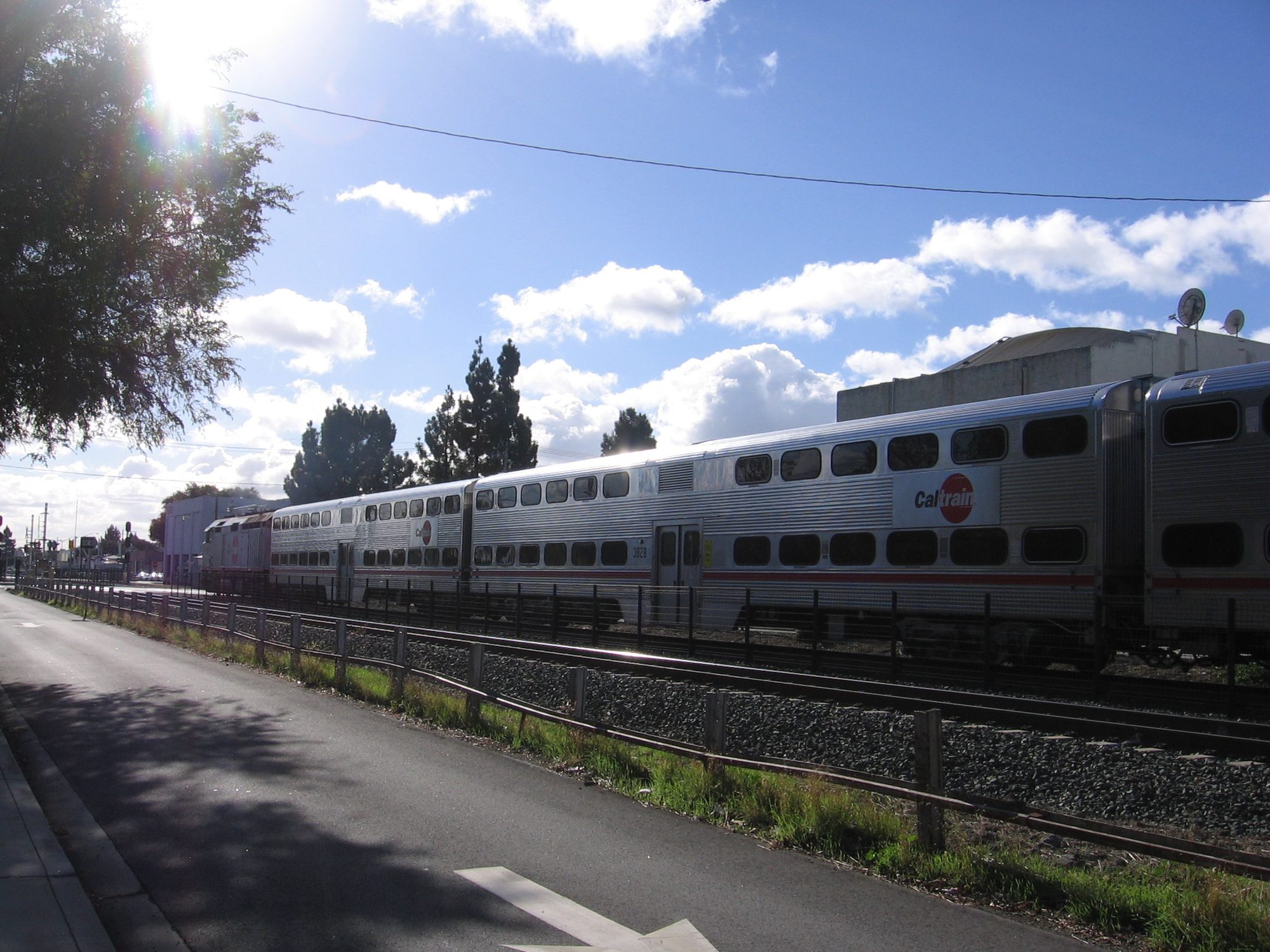 A southbound train in San Mateo, California, USA as seen at the East 3rd Avenue grade crossing.