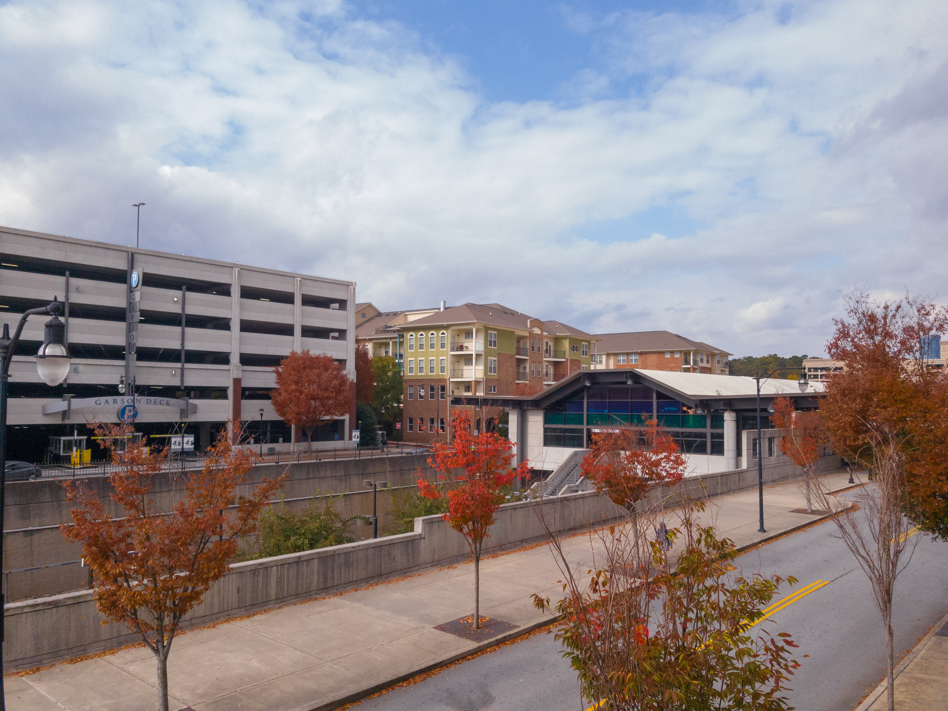 A MARTA rail station building with a multi-level parking garage alongside it.