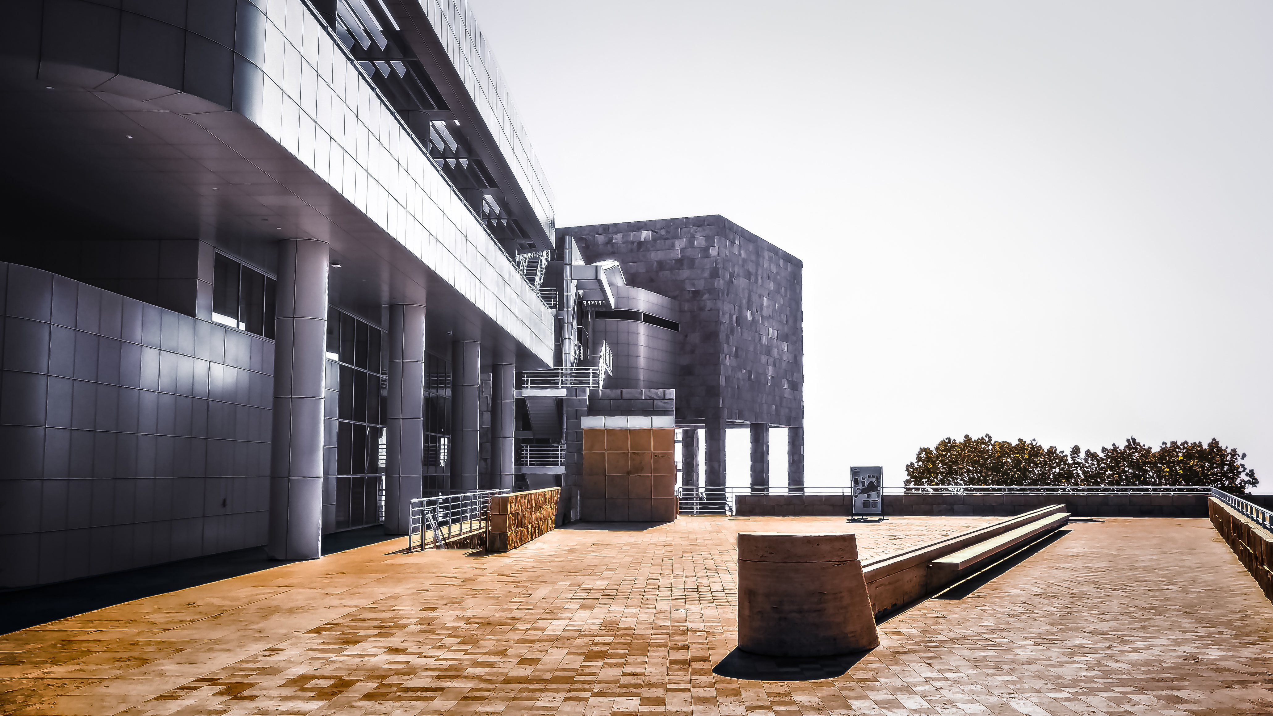 Exterior courtyard and stone-clad modernist buildings of the Getty Center campus.