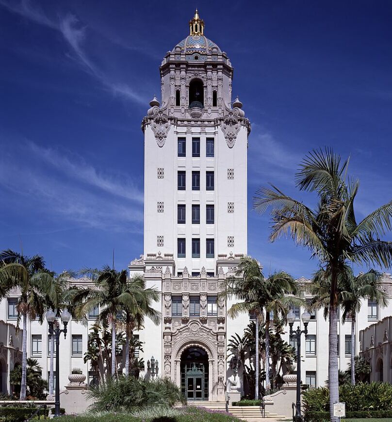 Close-up of Beverly Hills City Hall tower with tiled dome and gilded cupola.