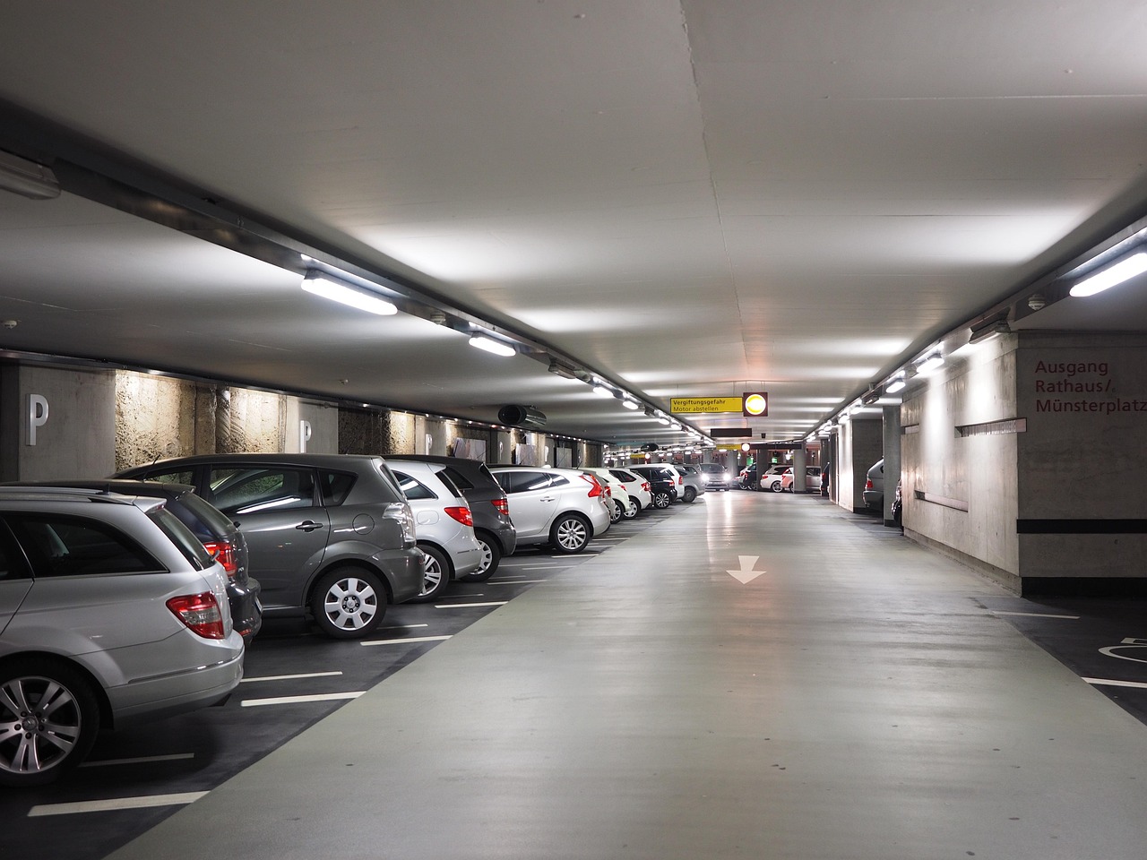 A parking garage filled with cars.