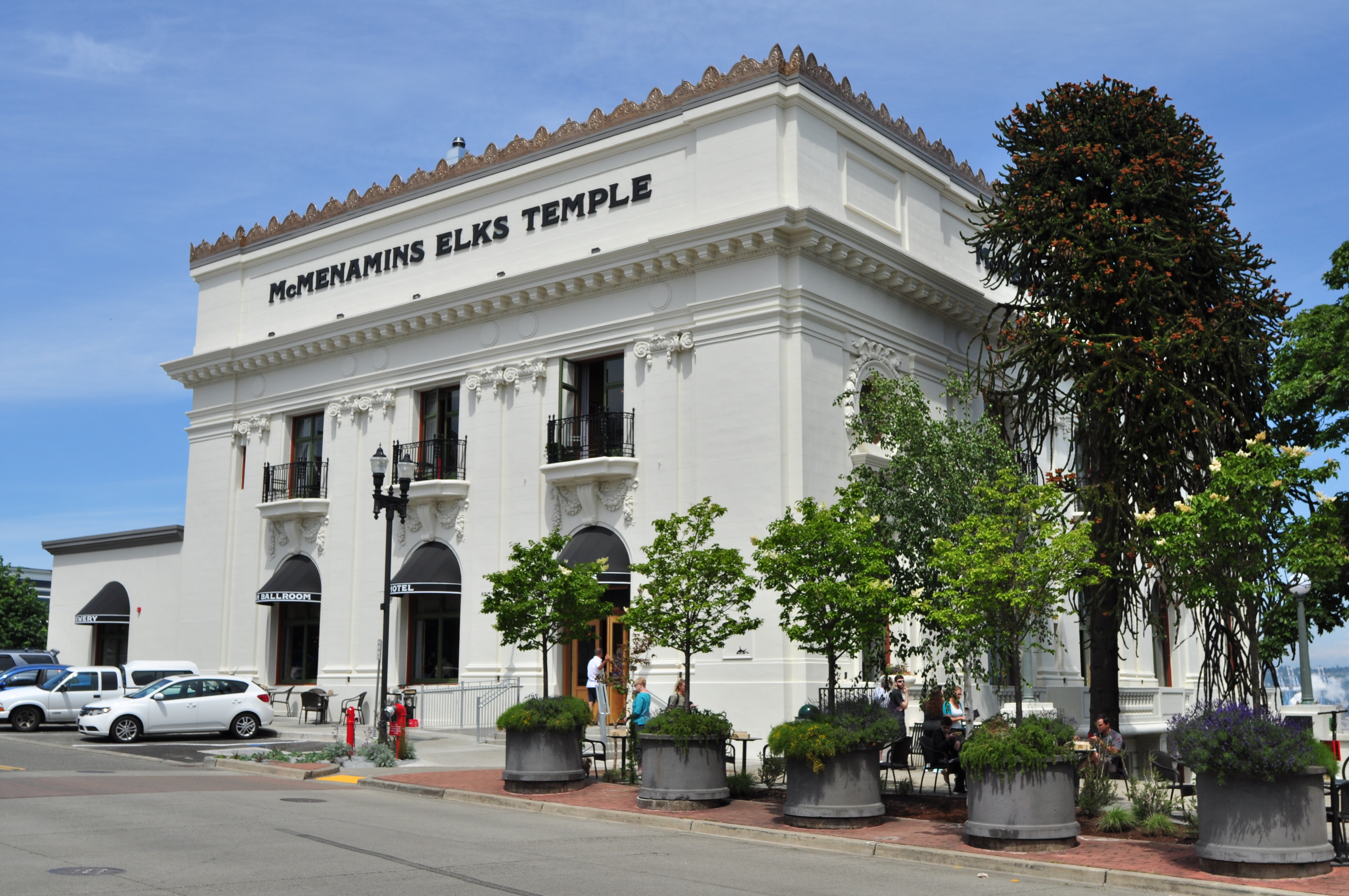 Exterior of a large white neoclassical building with ornate facade and balconies.