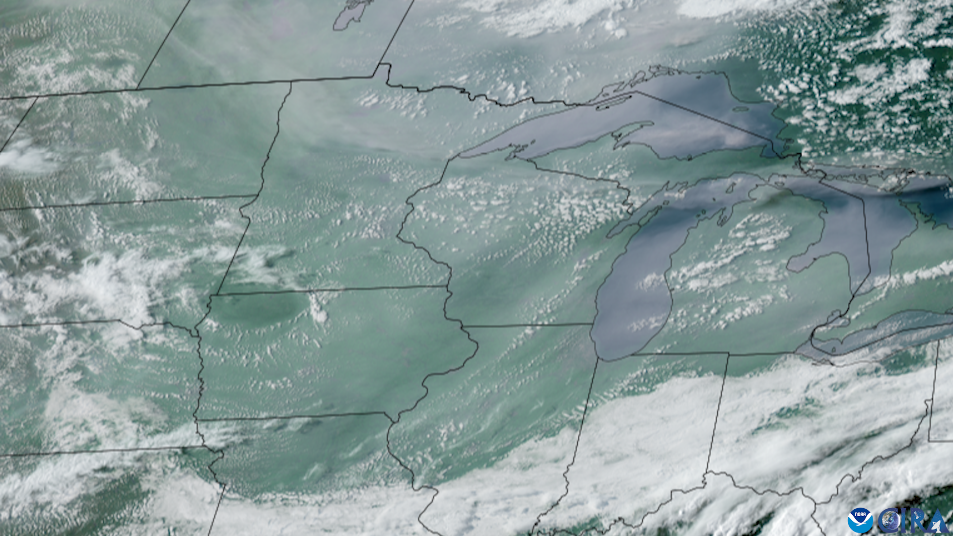 Satellite image of the Midwest showing widespread haze from wildfire smoke over the Great Lakes.