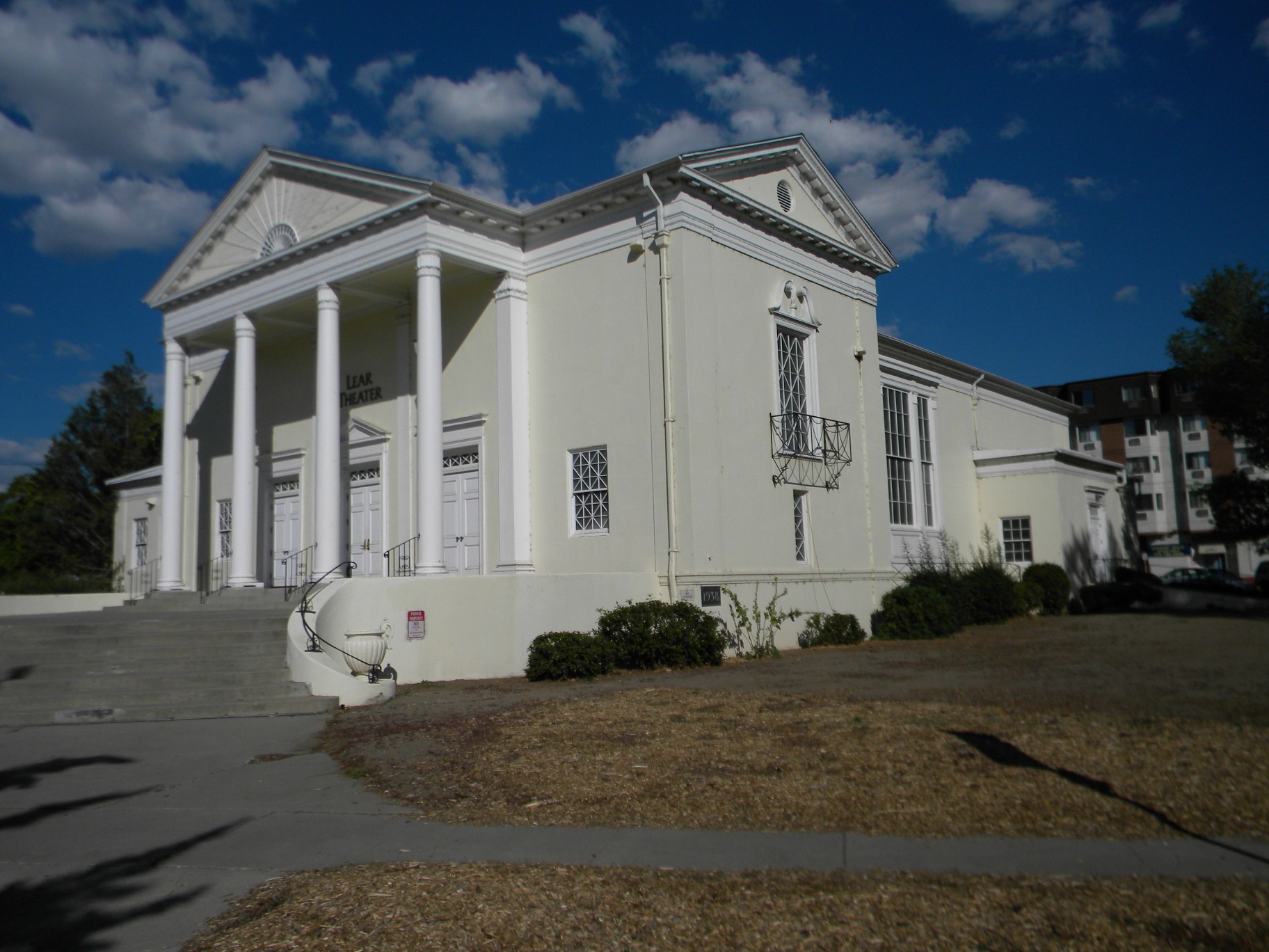 White neoclassical church building with large columns and a triangular pediment.