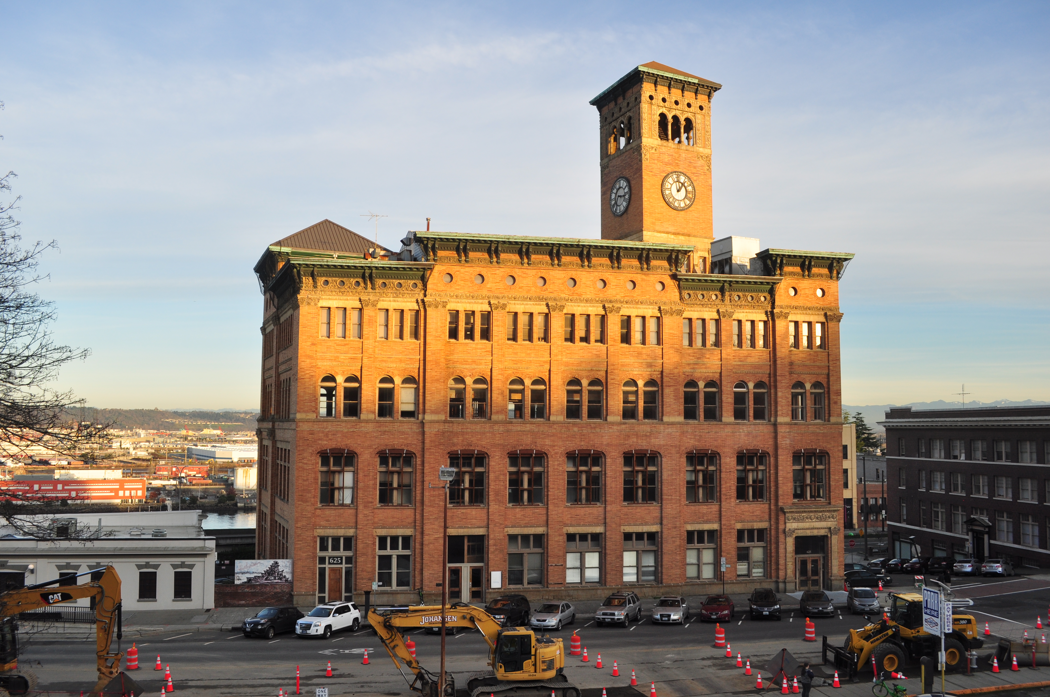 Historic red-brick building with a tall clock tower in Tacoma, Washington.