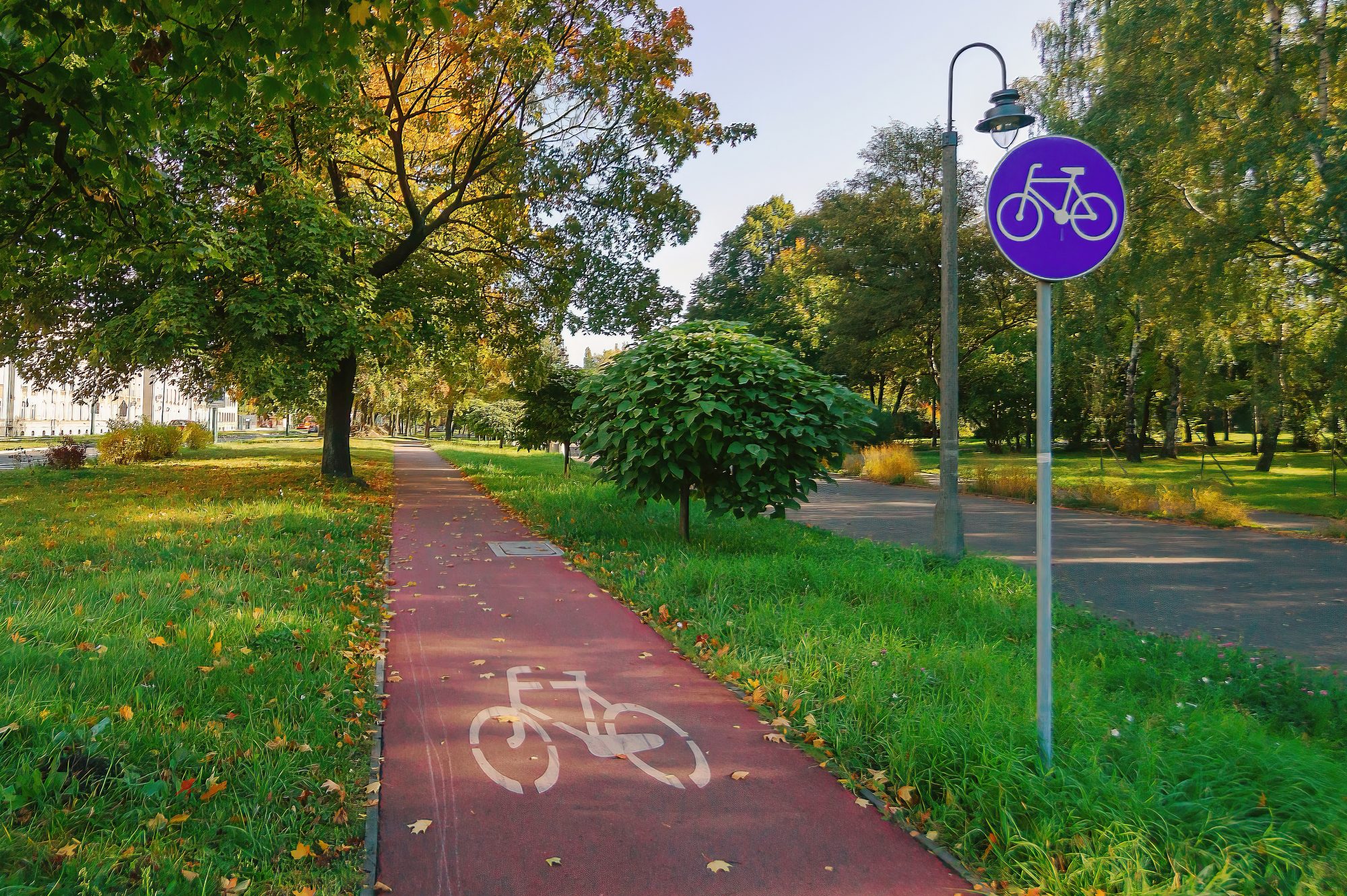Bicycle path with sign C13 marked beginning of bikeway in Poland; Bikeway through historical Sielecki Park in Sosnowiec, Poland;