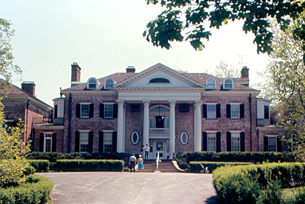 Large stone mansion at Cantigny Park surrounded by green lawns and trees.