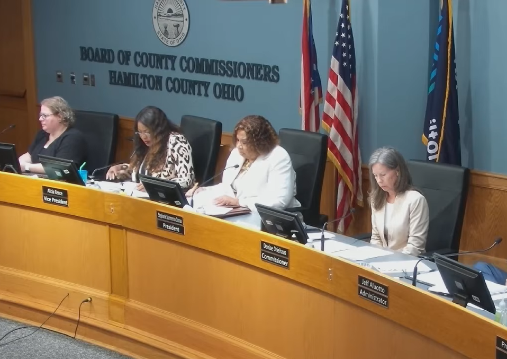 Four women seated at a government dais labeled Board of County Commissioners Hamilton County Ohio.