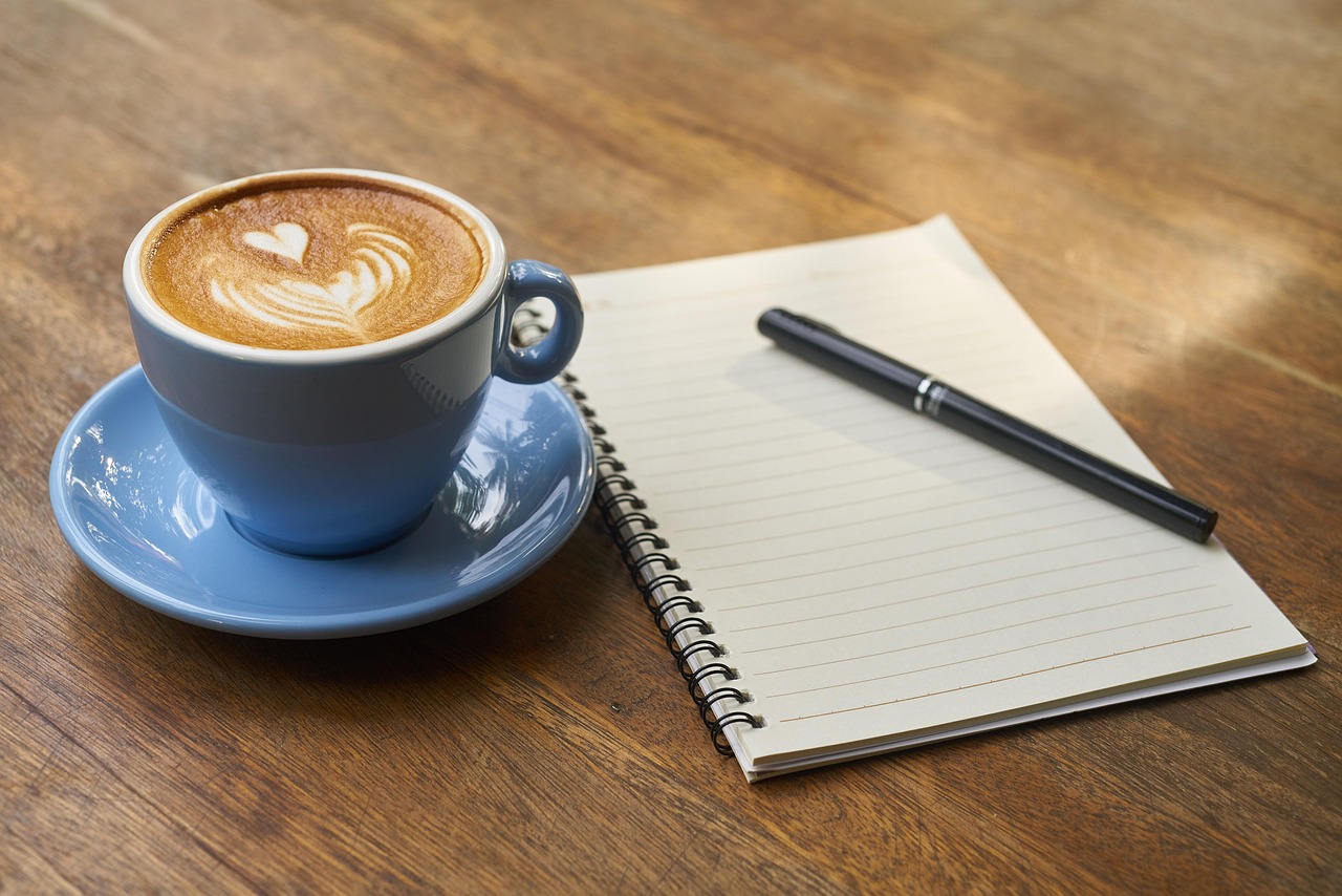 Coffee, pen, notebook, open notebook, empty notebook, caffeine, cup, cafe, coffee cup, latte, latte art, cappuccino, mor
