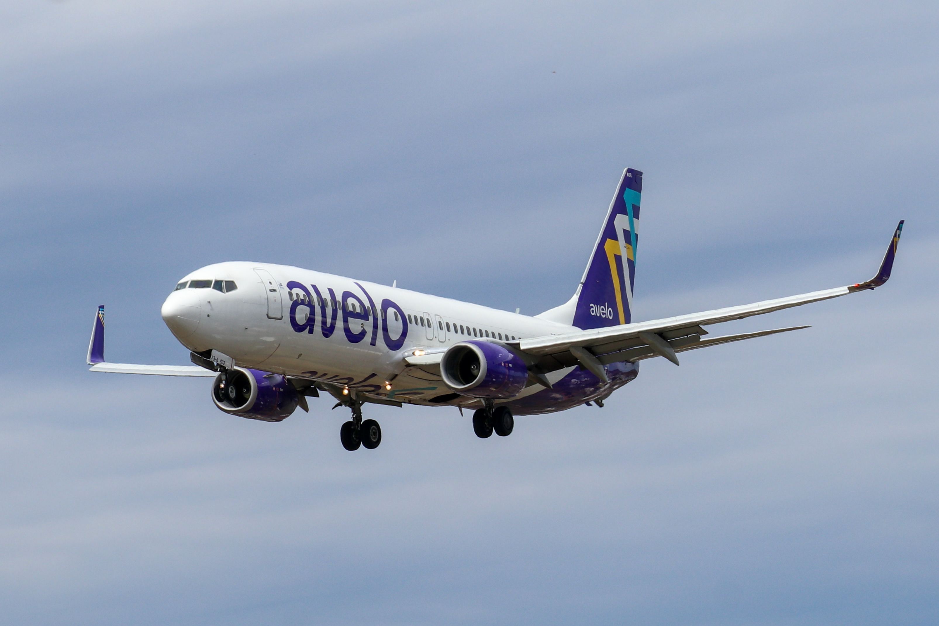 Avelo Airlines Boeing 737-800 aircraft on final approach, landing gear down.
