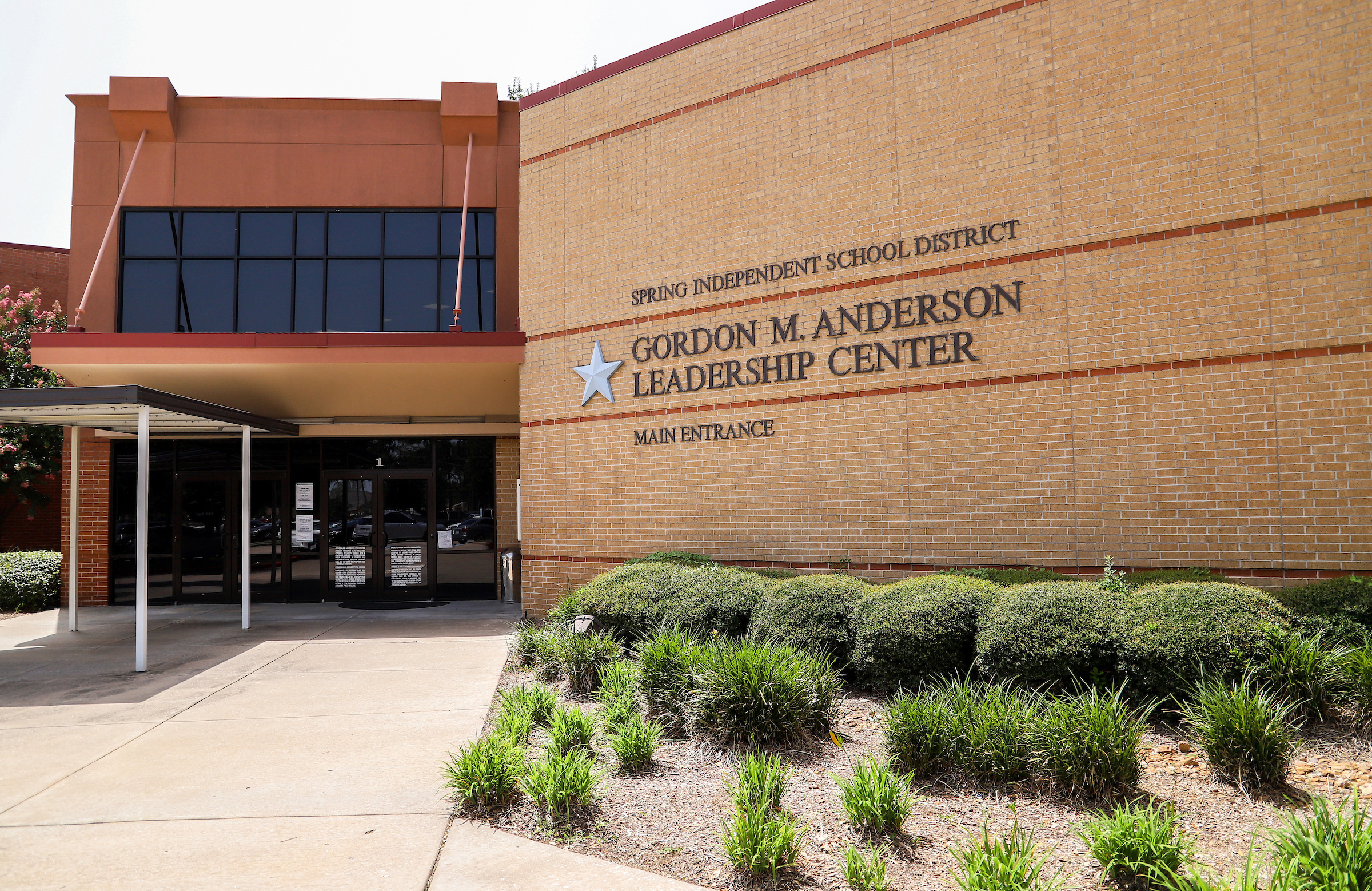 Brick exterior of the Spring ISD administration building with district signage and main entrance.