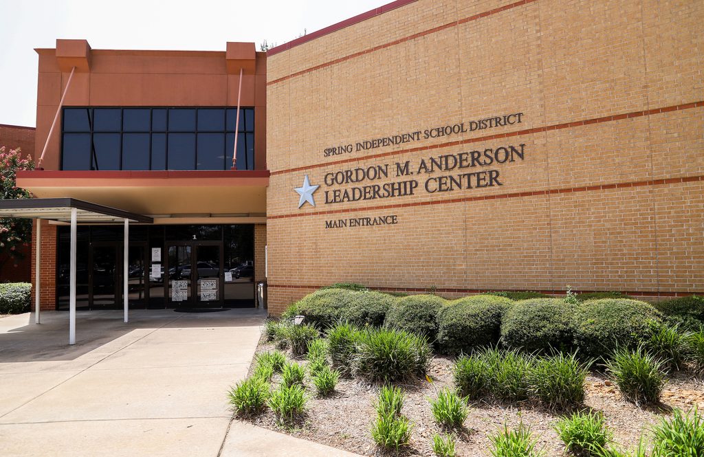 Brick building with Spring ISD signage and a covered main entrance.