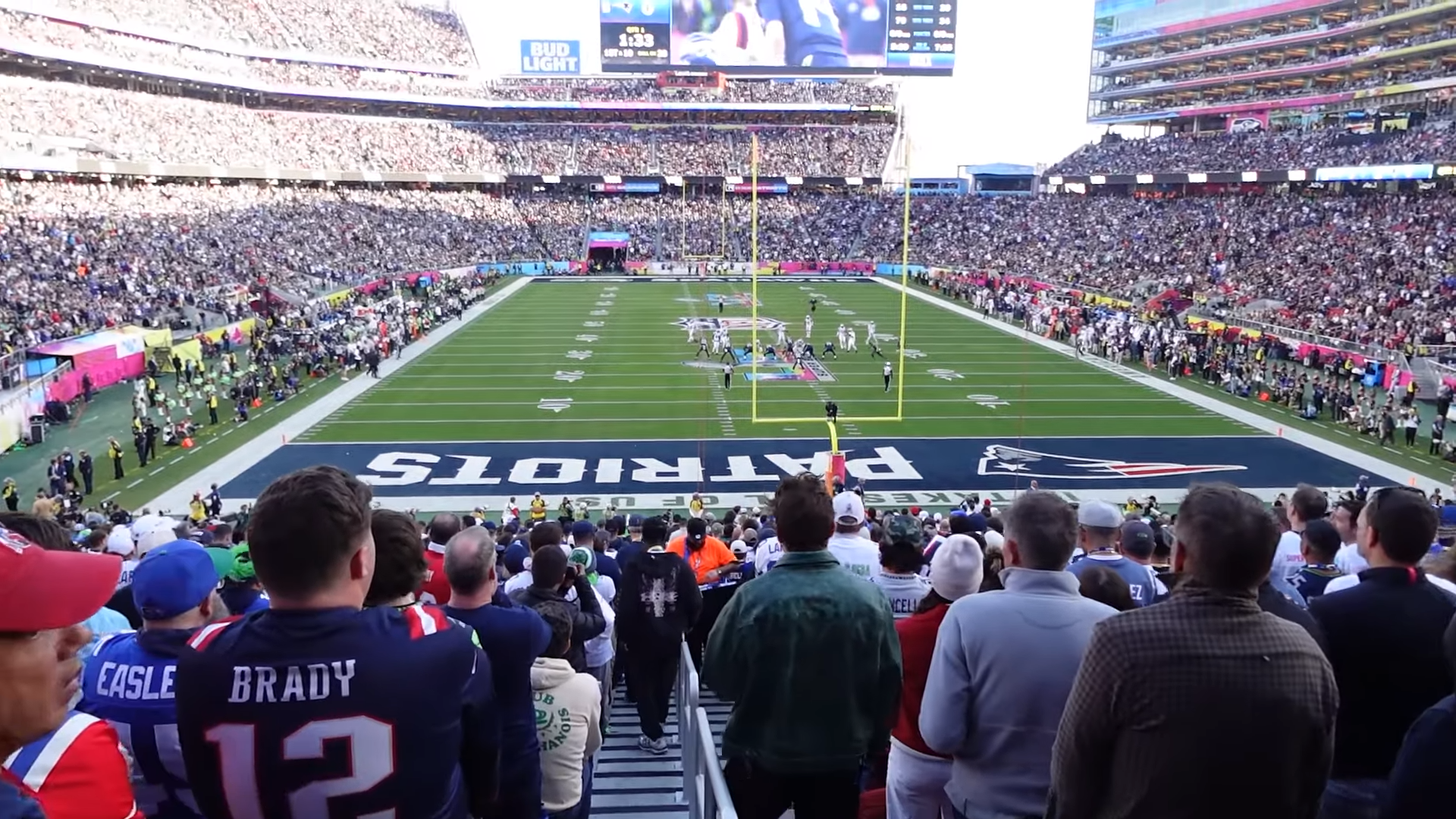 Packed stadium crowd watching a Seattle Seahawks possession during Super Bowl LX.